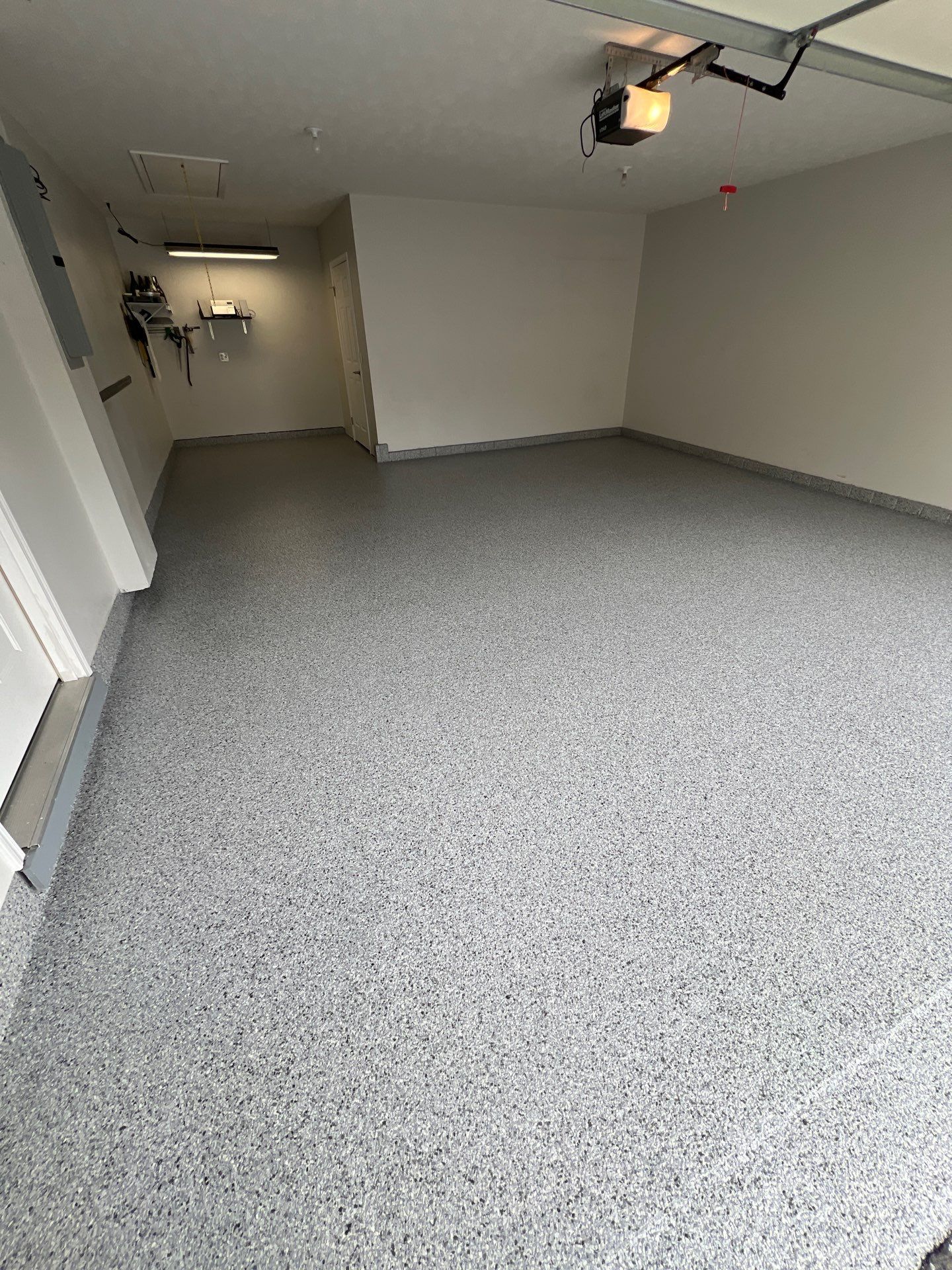 Silverado garage floor coating  by NG Masonry & Construction LLC