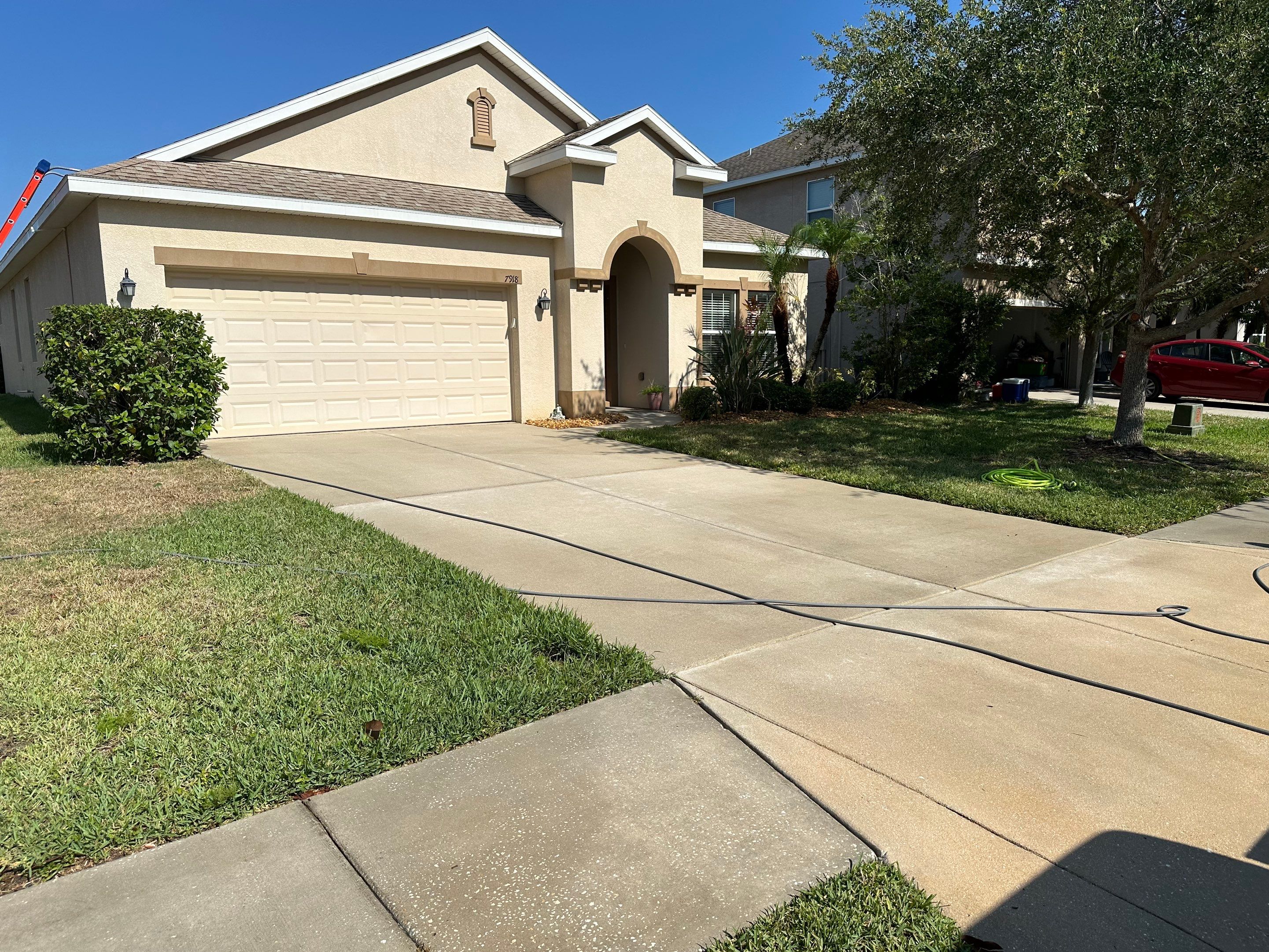 Asphalt Shingle Roof Soft Wash Cleaning & Concrete Pressure Washing in CopperStone Community, Parrish, FL by Sunshine AquaWash