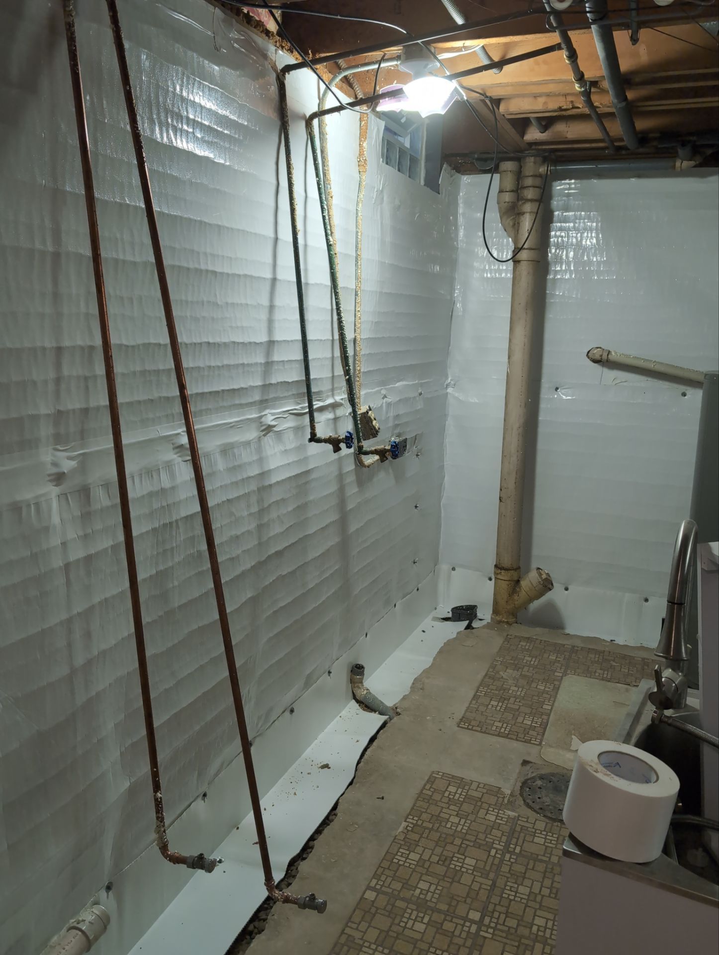 Interior Basement Waterproofing System and Egress Window Installation by Toledo Basement Repair 