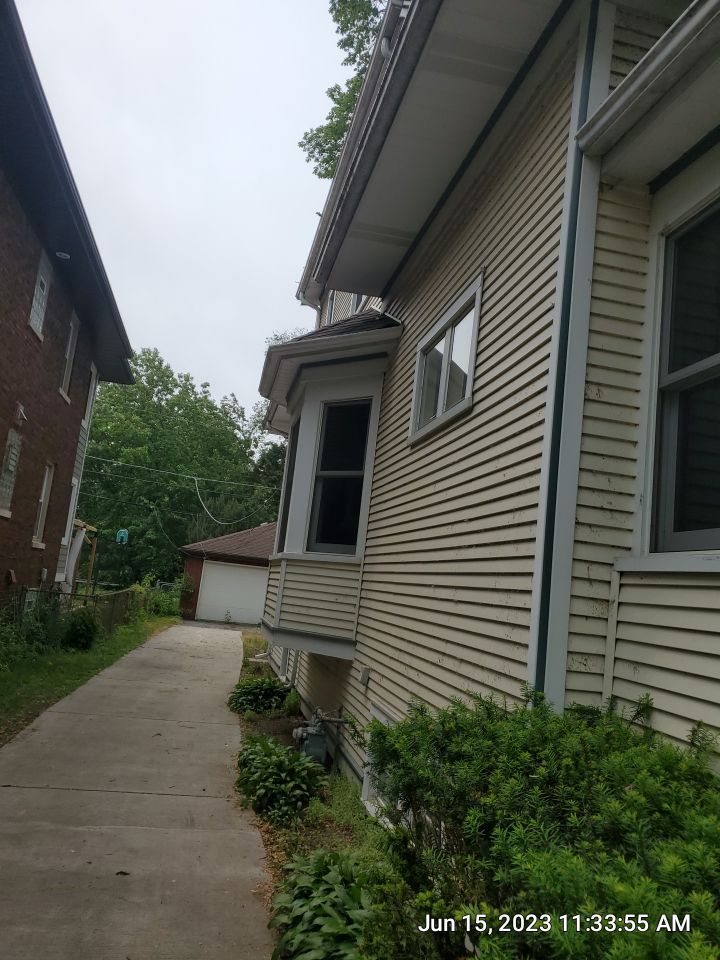 Housewashing  using Algaecide, soft wash soap by Northern Power Washing LLC.