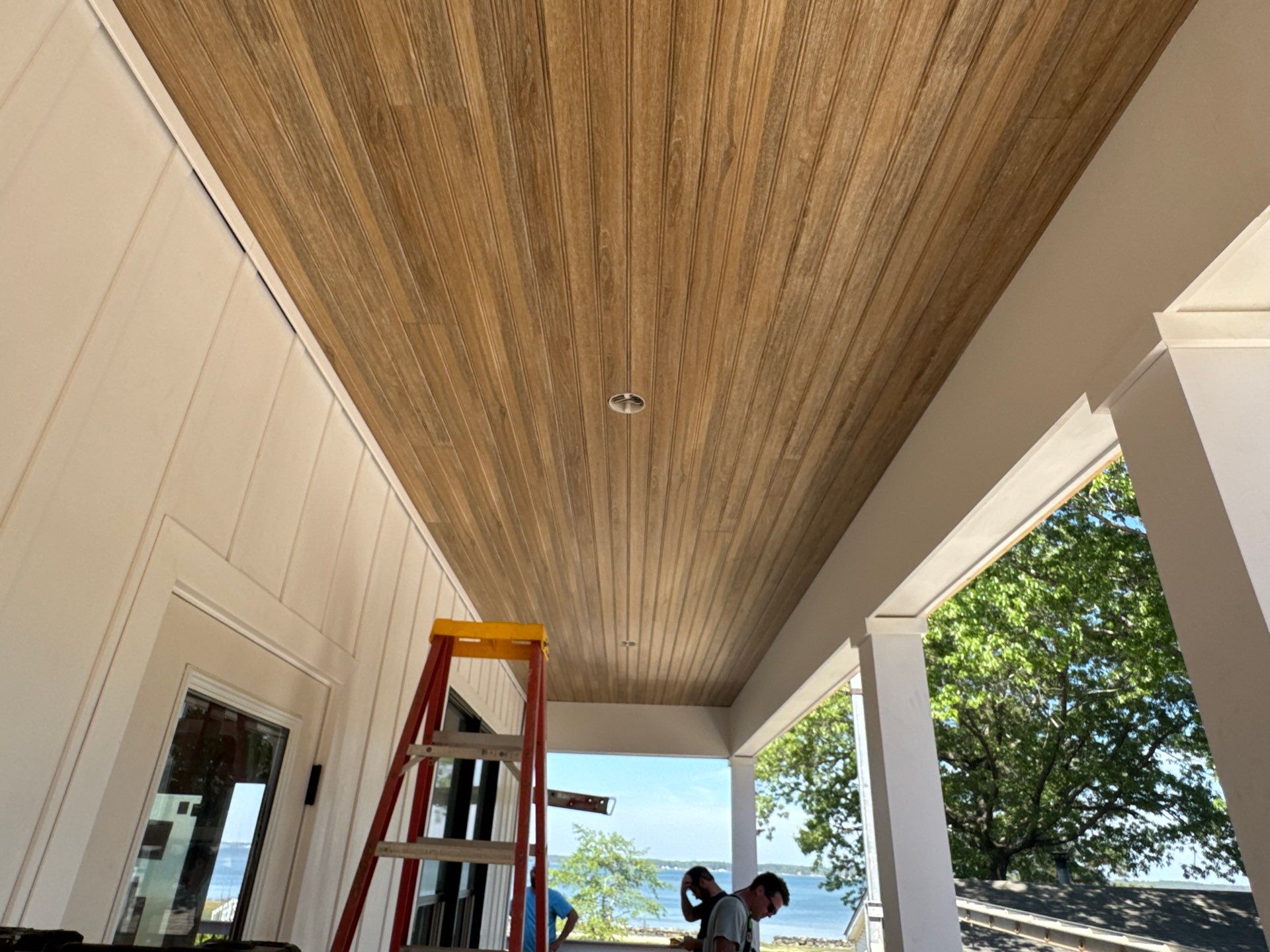 Two-Story Custom Home With Board and Batten Siding by Cade Construction