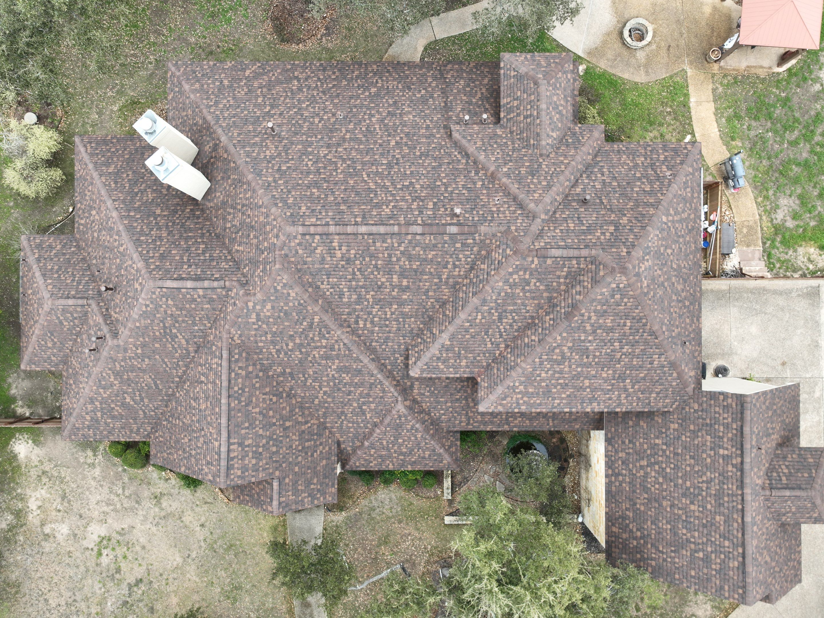 Residential Roof Replacement using 30 Year Laminate Shingles with High Profile Ridge by Premier Roofing and Contracting