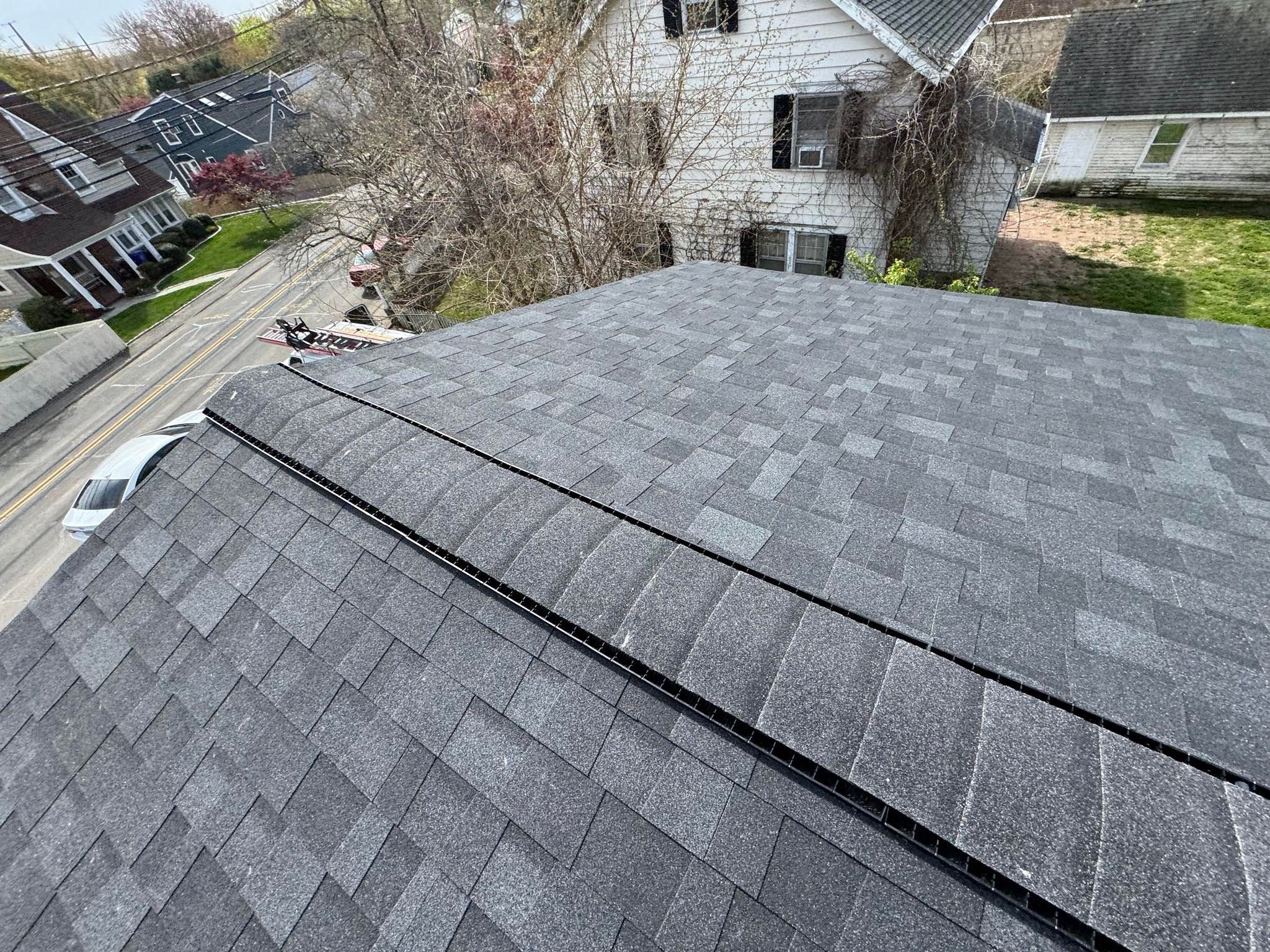 Charcoal Shingles by Reimagine Roofing