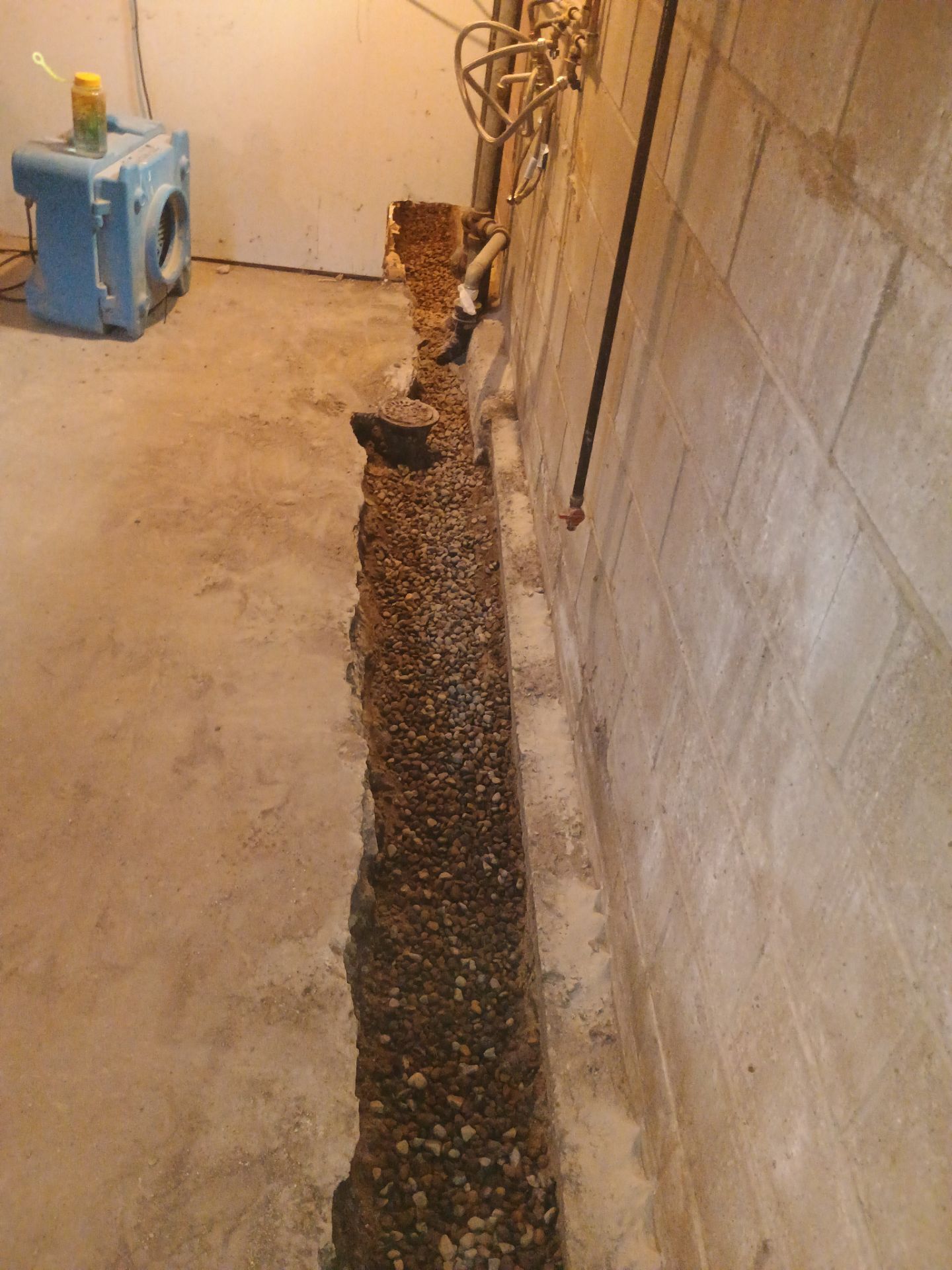 Interior Drain Tile & Buried Discharge in South Minneapolis by Waterproofing Northeast