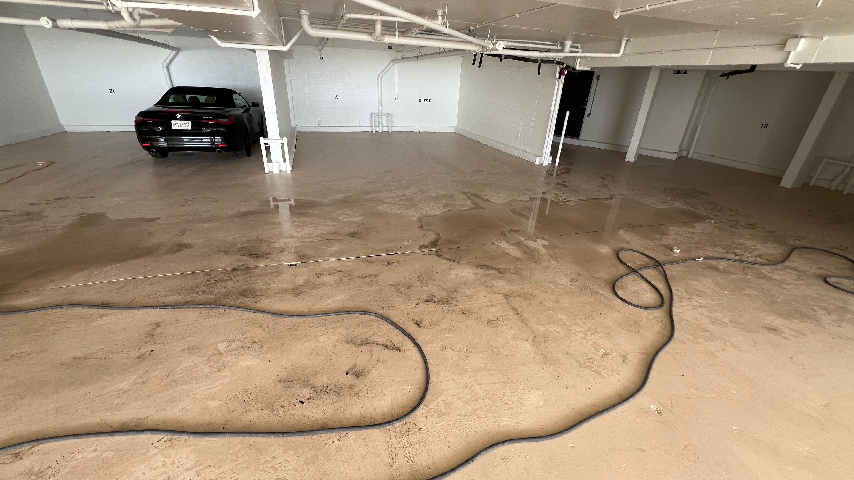 Isles of Capri Condo Parking Garage Drainage System Cleaning by APS Power & Water