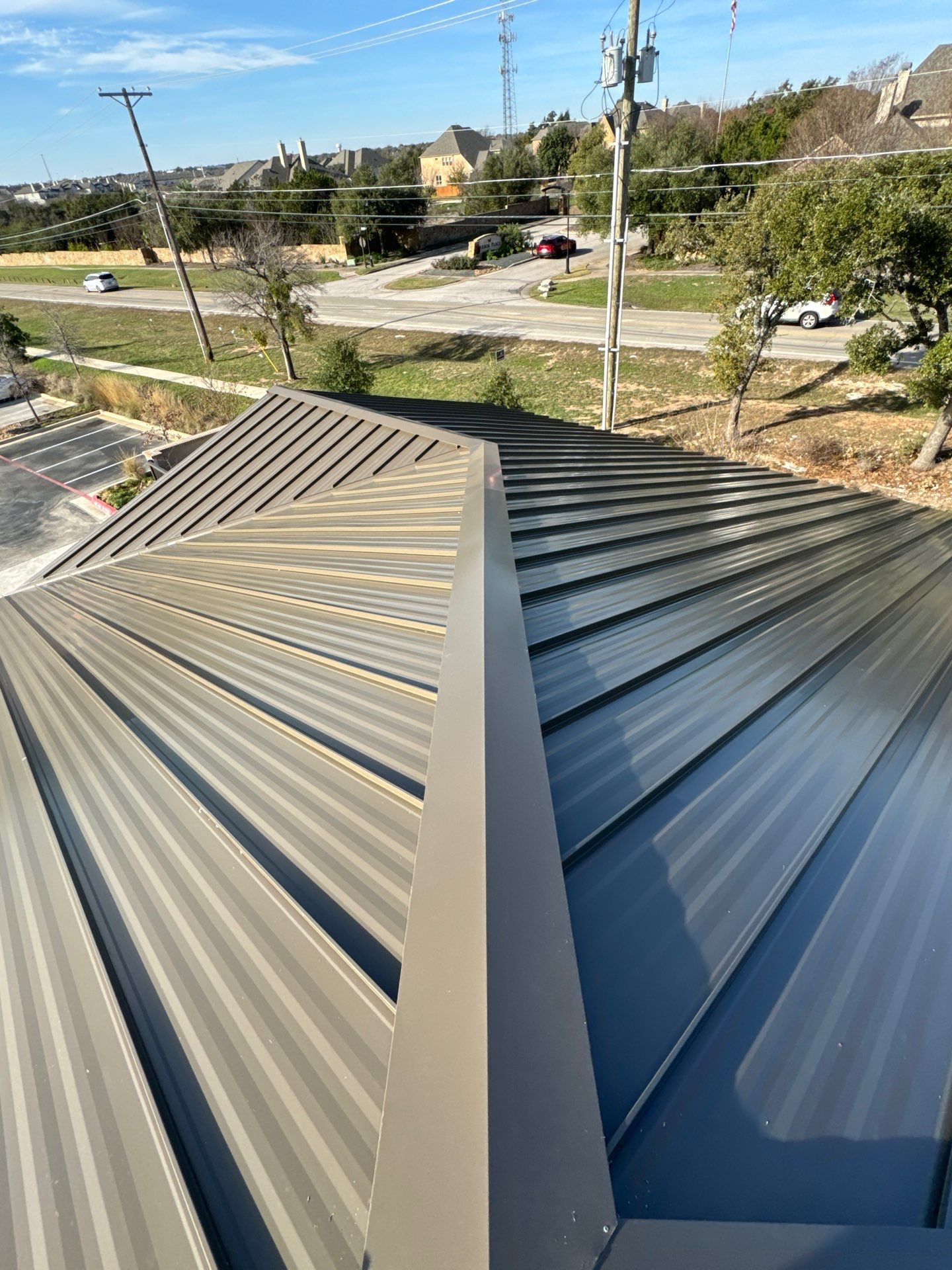 Commercial Roofing Installation using 24 GA Standing Seam by Action Exteriors Austin