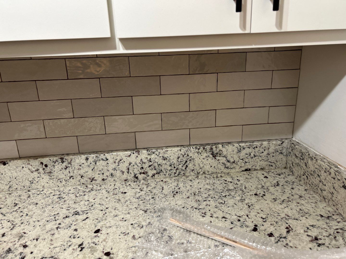 Brick pattern tiles for a bathroom and kitchen by Footprints Floors of Nashville