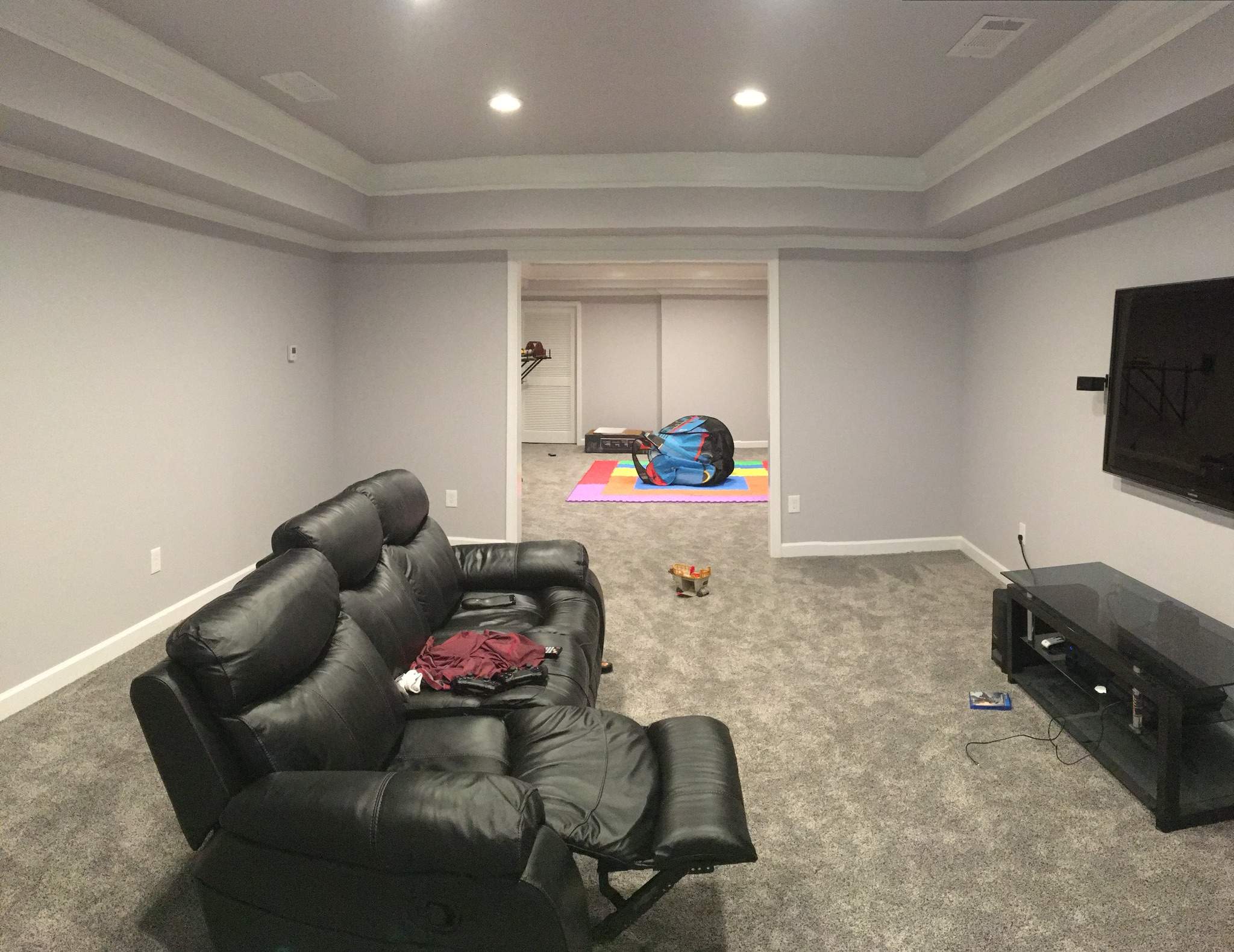 Finished Basement with Custom Media Room and Bathroom in Duluth by Swift Home Renovations