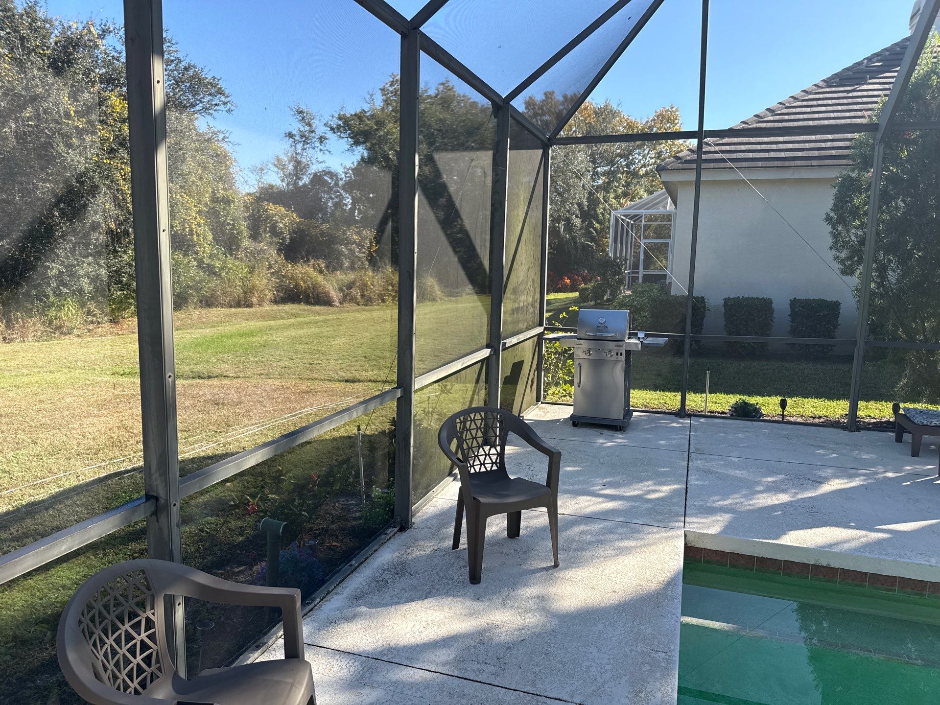 Painted Pool Deck, Lanai & Pool Cage Cleaning in River Club South – Bradenton, FL by Sunshine AquaWash
