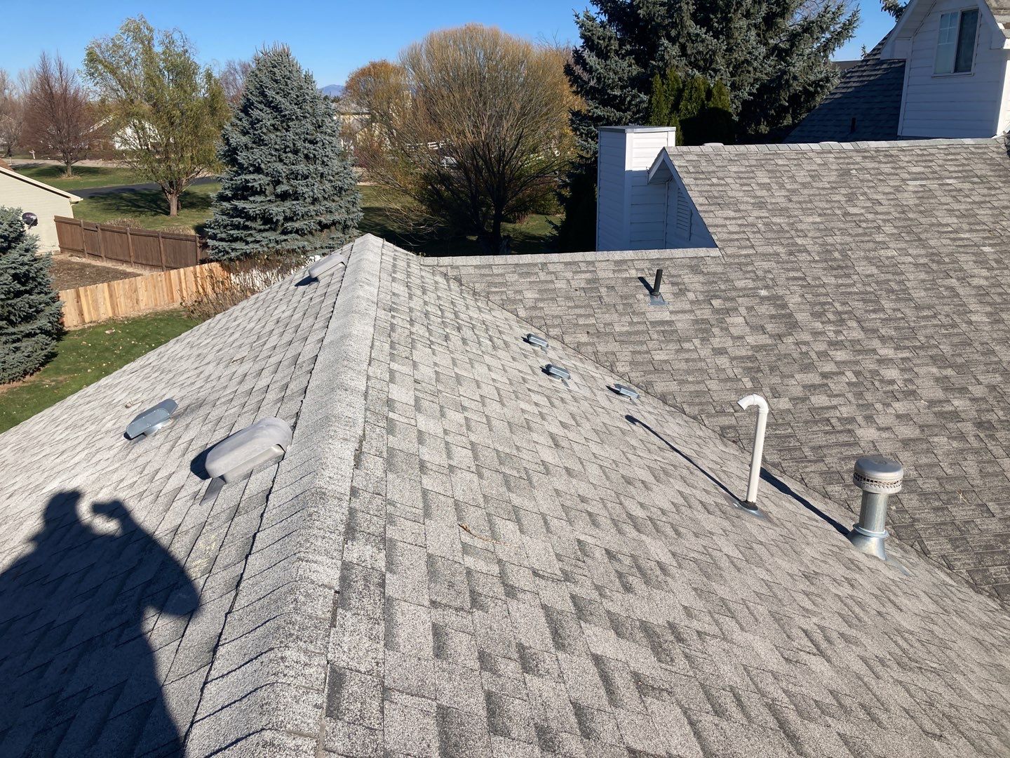 Two story farmhouse style roofing installation using Owens Corning Duration in the color Teak by ID Roofing LLC