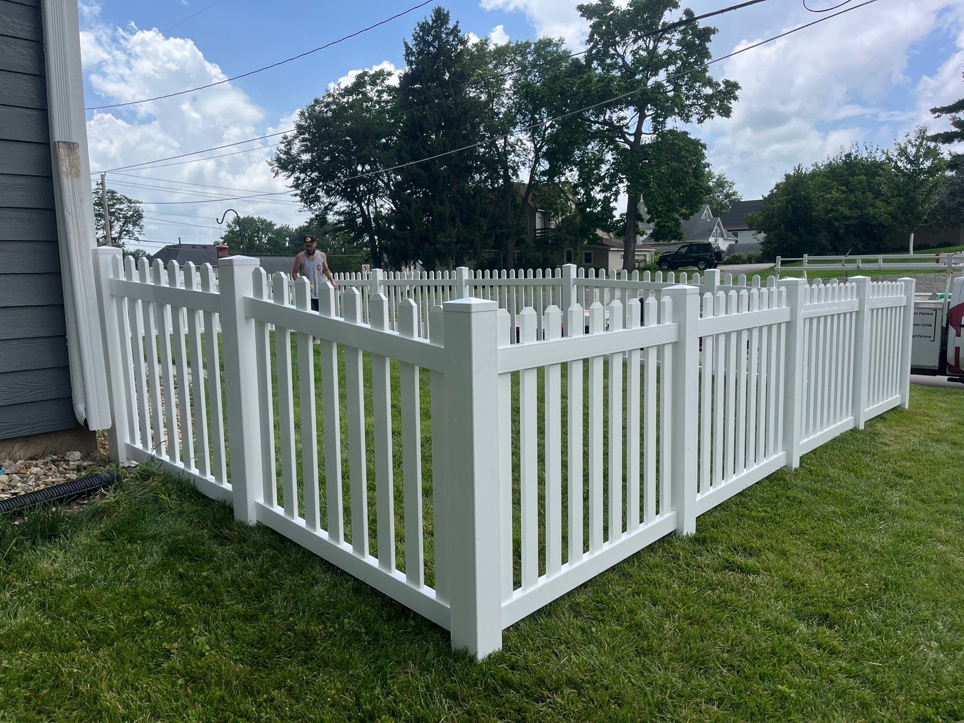 White Vinyl Spaced Picket Fence Installation in Cedar Falls by Perfect Picket Fence and Stain