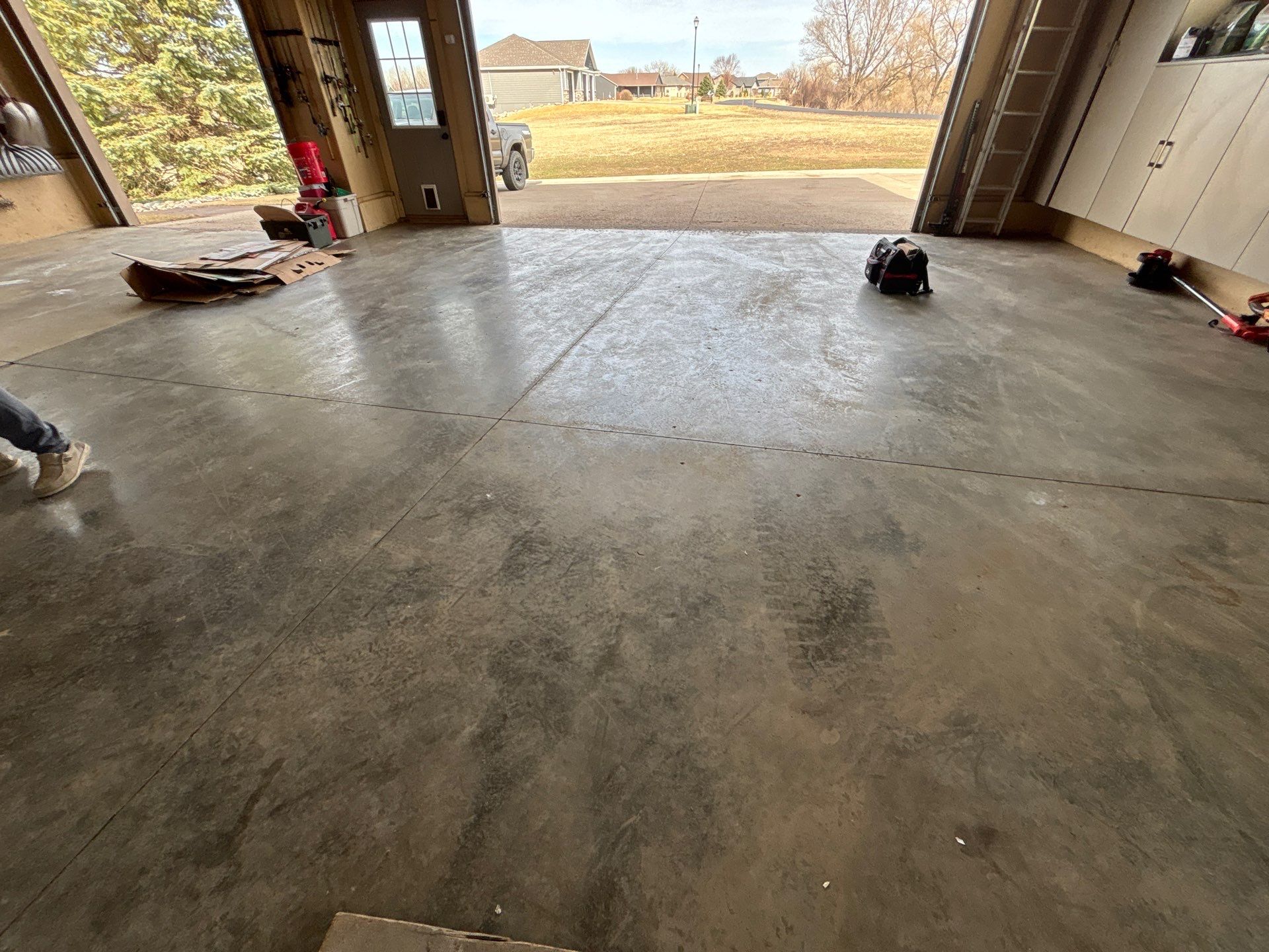 Residential Garage Floor Transformation with Speckled Epoxy Coating by Select Painting, Coatings & Garage Cabinets