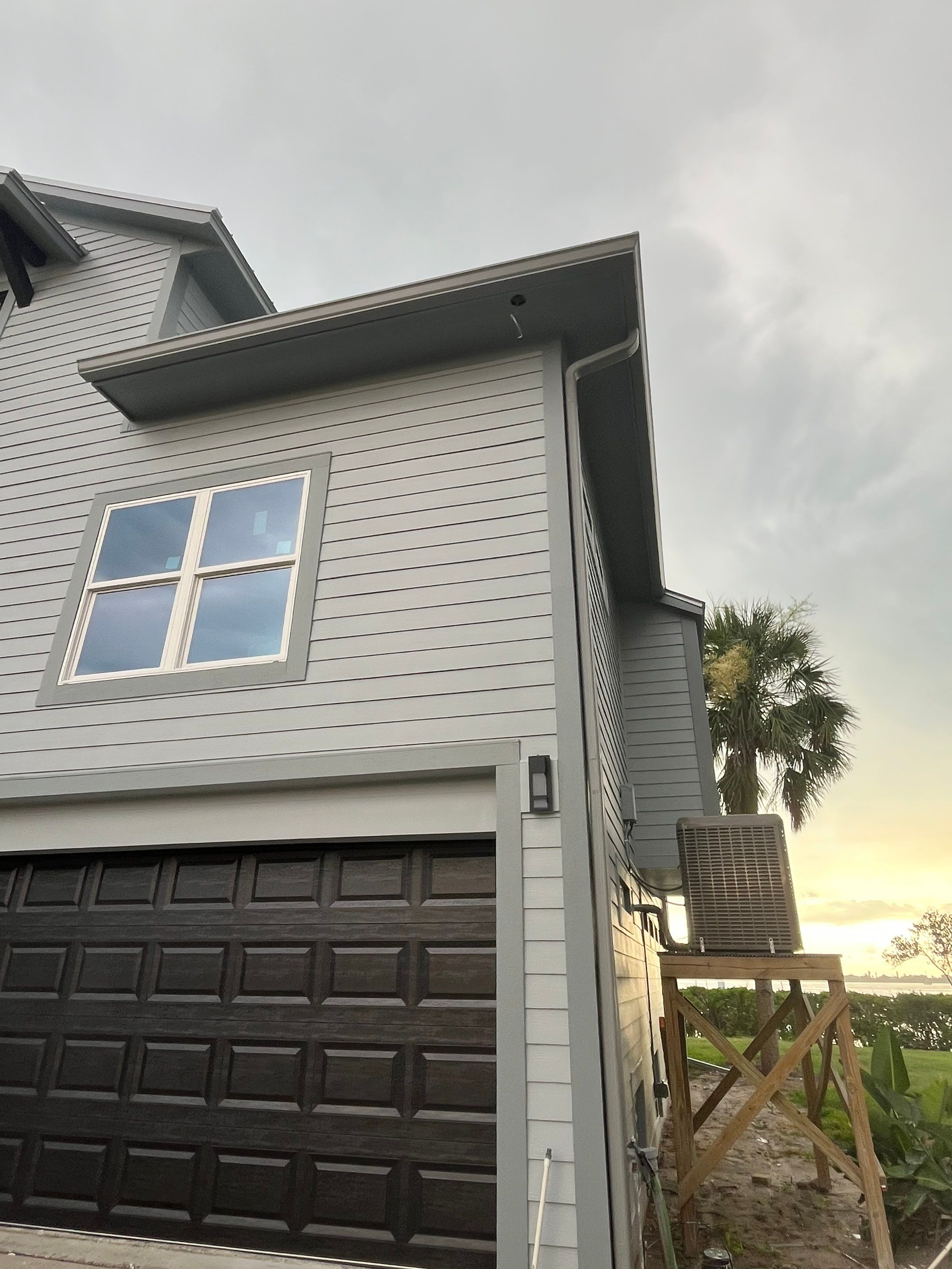 Downspout Installation Dove Grey Palmetto FL by Gutter Professors