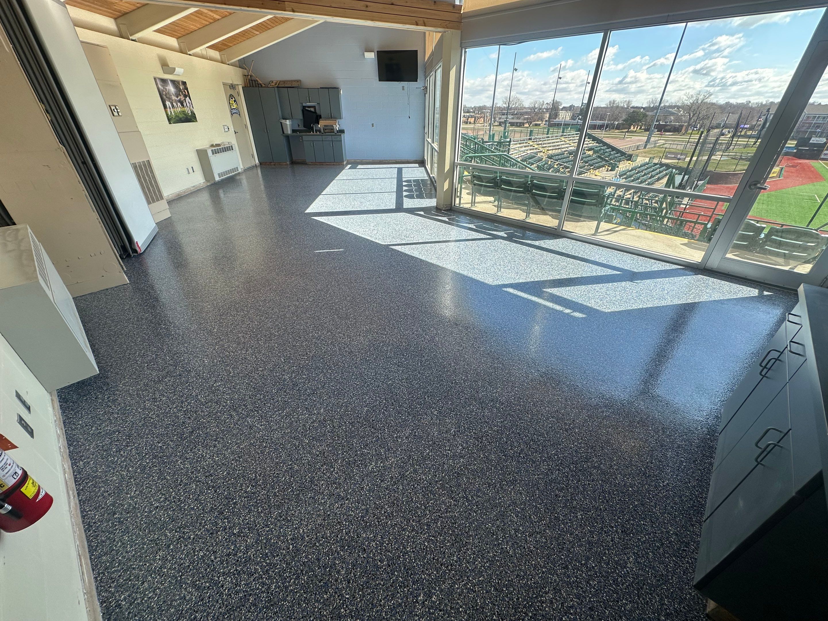 Commercial Epoxy Floor Coating for Stadium Viewing Suites in Sioux Falls by Select Painting, Coatings & Garage Cabinets