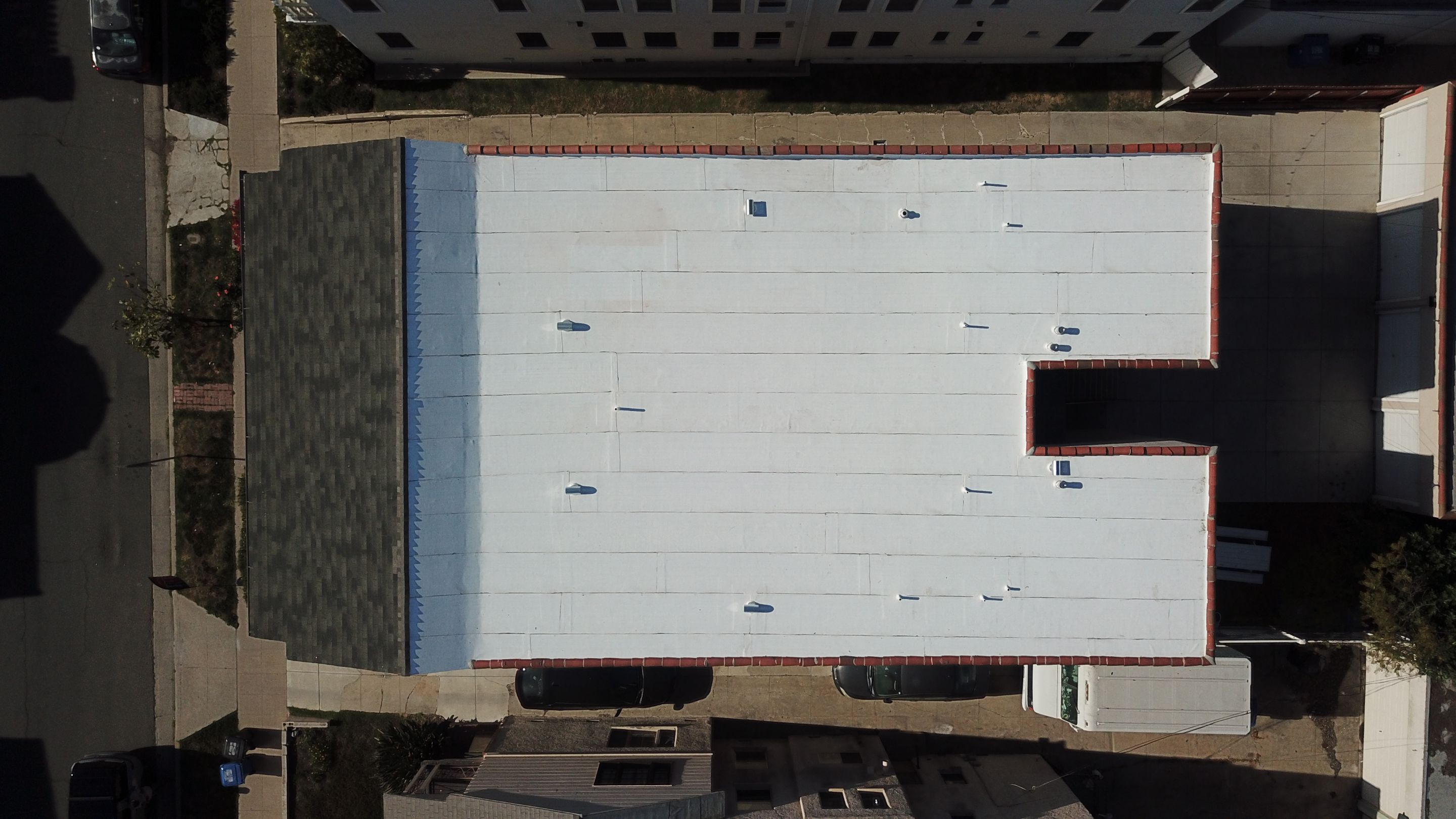 Apartment Building Reroofing using Polyfresko® G Highly Reflective Modified Bitumen Cap Sheet by Hull Brothers Roofing