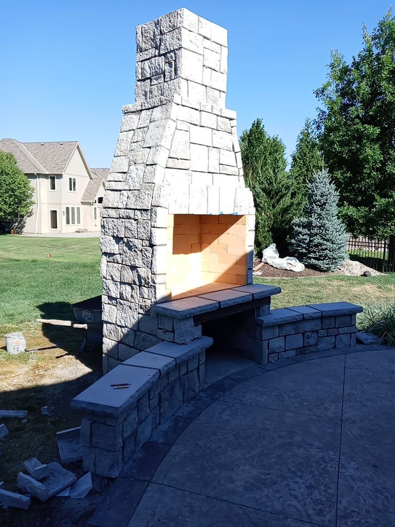 Back Yard Fireplace and Landscape by LAND ESCAPES LLC