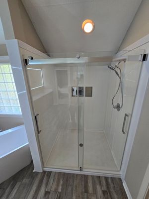 Full bathroom remodel with Artus lighted mirrors, Waltz bathtub and Mercury doors
