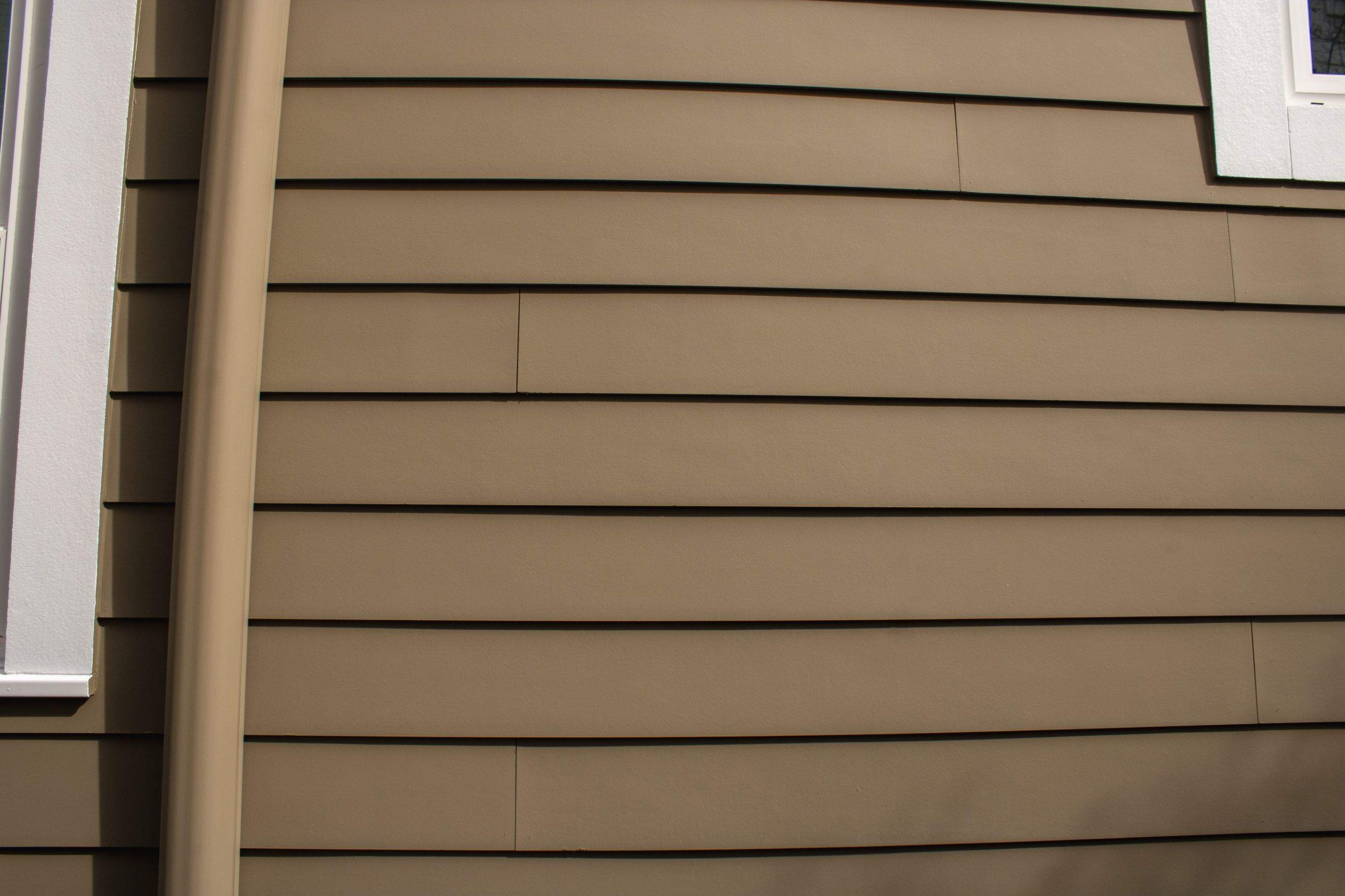 Full Siding Replacement, Deck Build, Exterior Paint, and Gutter Replacement  by Nelson Exteriors 