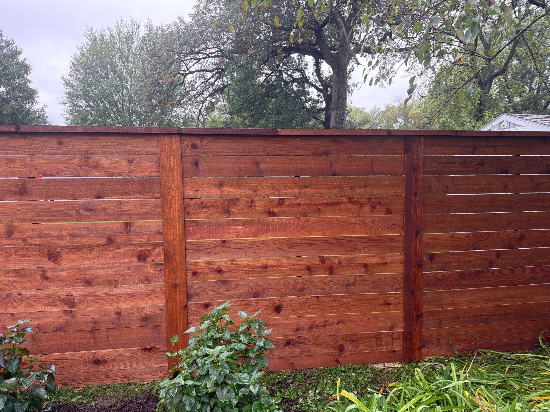 Stained Horizontal Cedar Wood Privacy Fence in Cedar Falls by Perfect Picket Fence and Stain