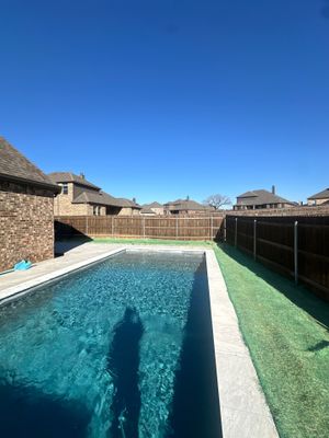 Modern Lap Pool with Turf Surround