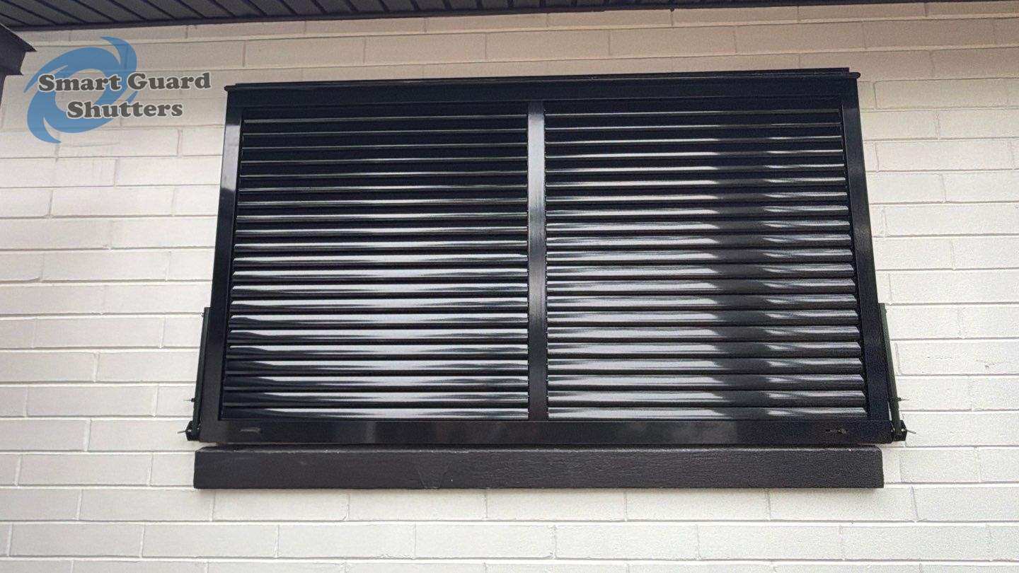 Impact Bahama Shutters in Jet Black by Smart Guard Shutters