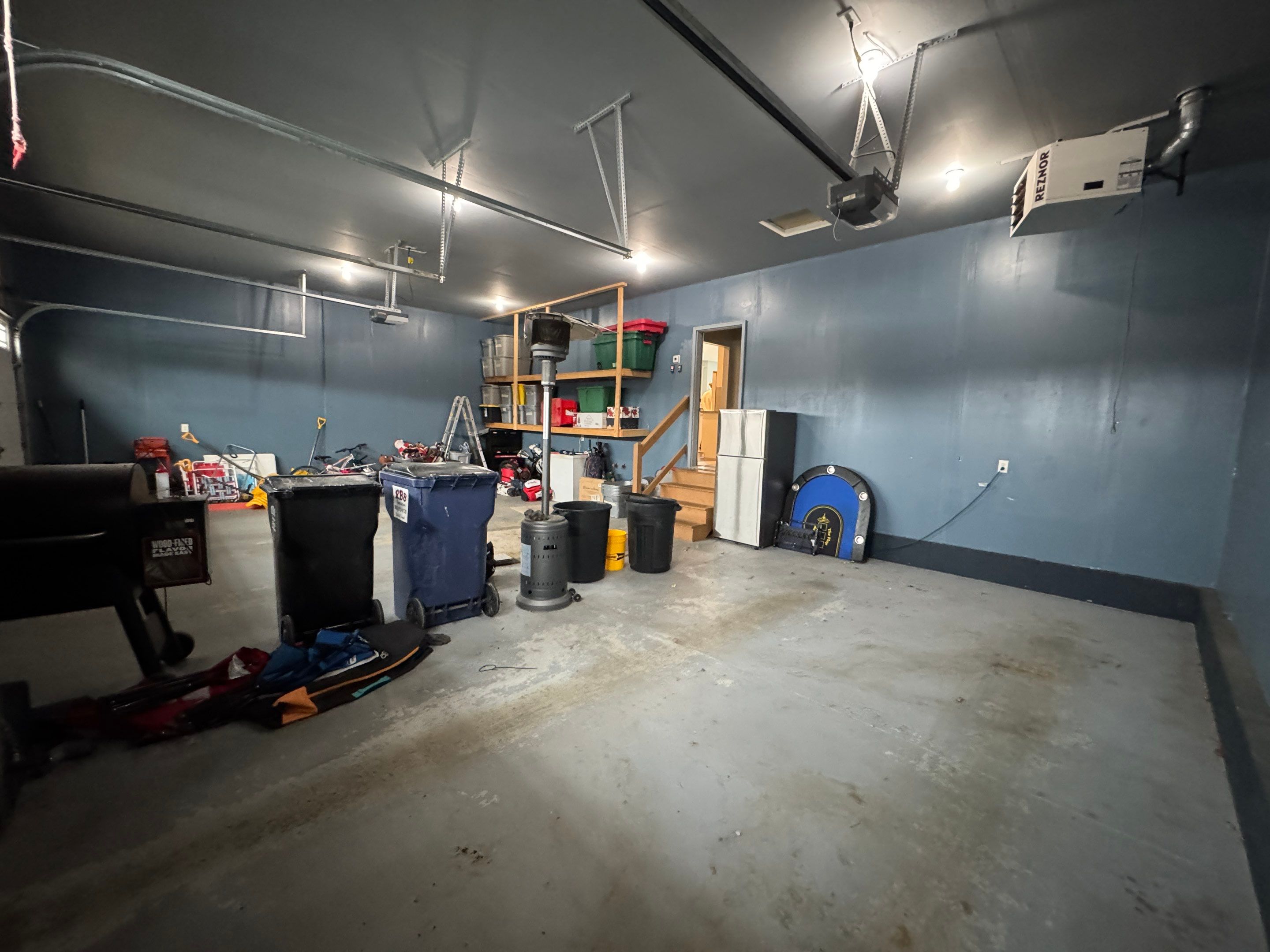 Grey Speckled Epoxy Garage Floor and Stair Coating in Sioux Falls by Select Painting, Coatings & Garage Cabinets