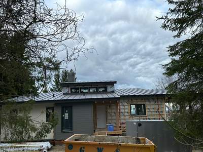 Residential Roofing Installation using 24 Ga Standing Seam Metal