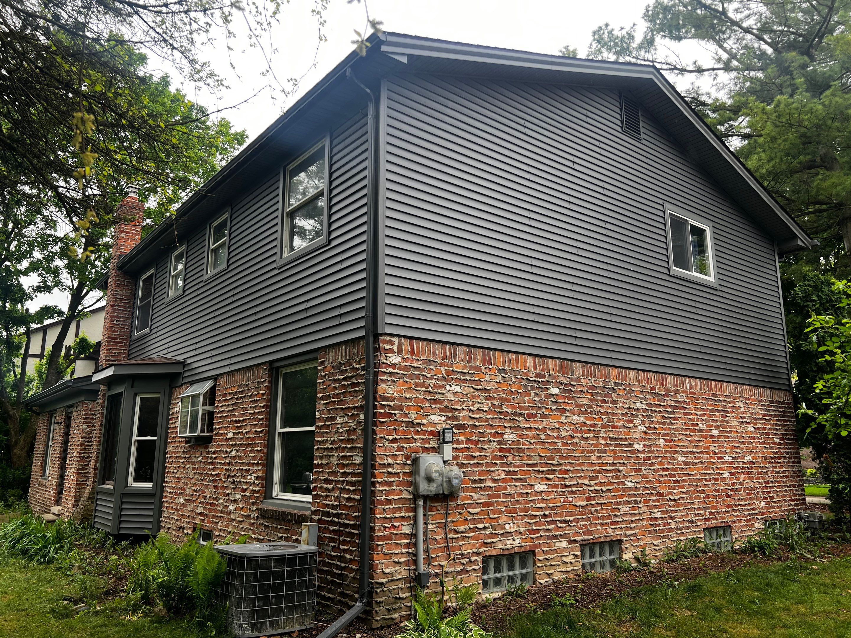 Siding Replacement  using Certainteed Monogram Vinyl D4" Smoky Gray color by Bloomfield Construction & Restoration