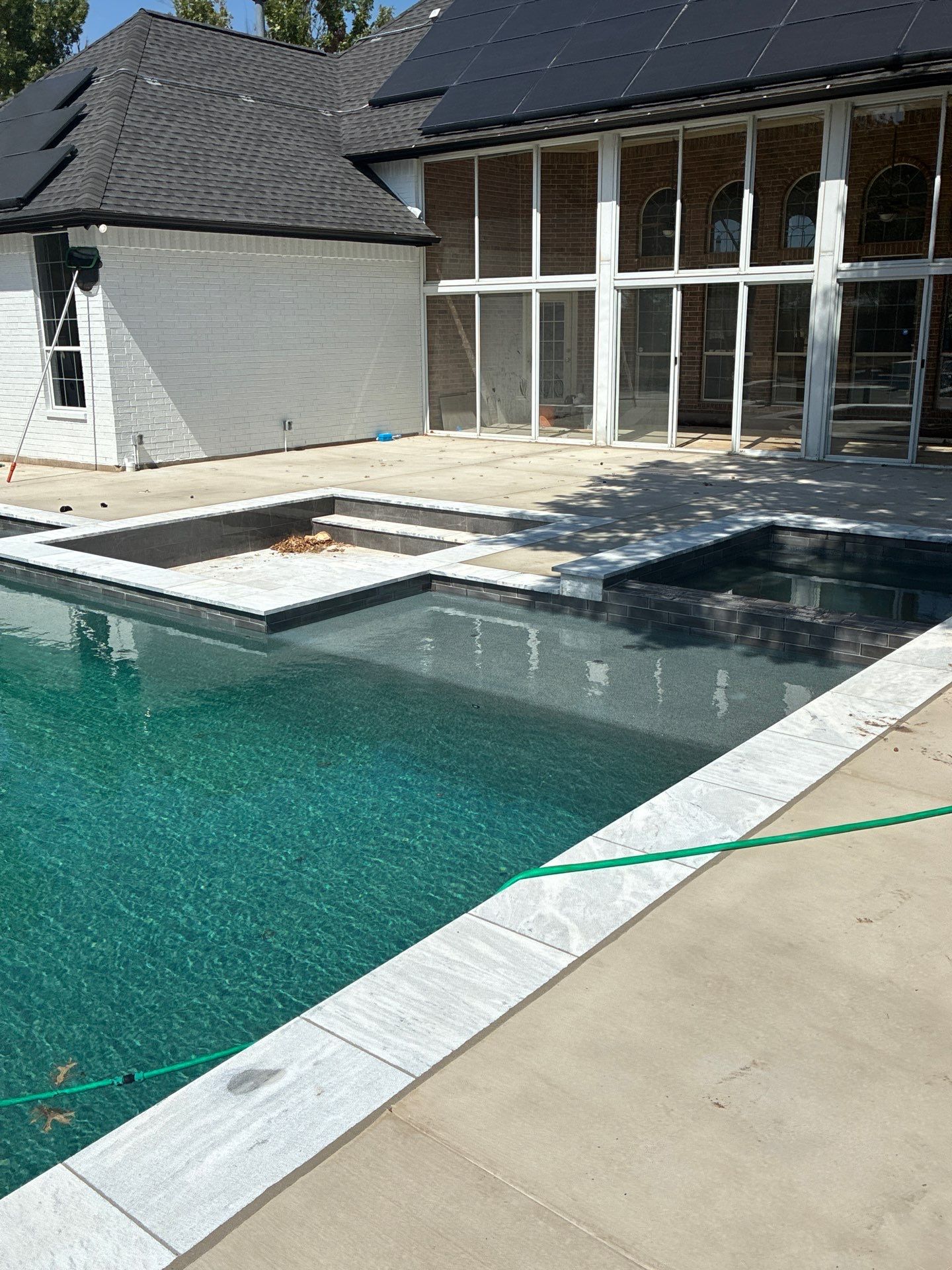 Modern Geometric Pool with Raised Spa and Sun Ledge by Pinnacle Pools and Spas - DFW