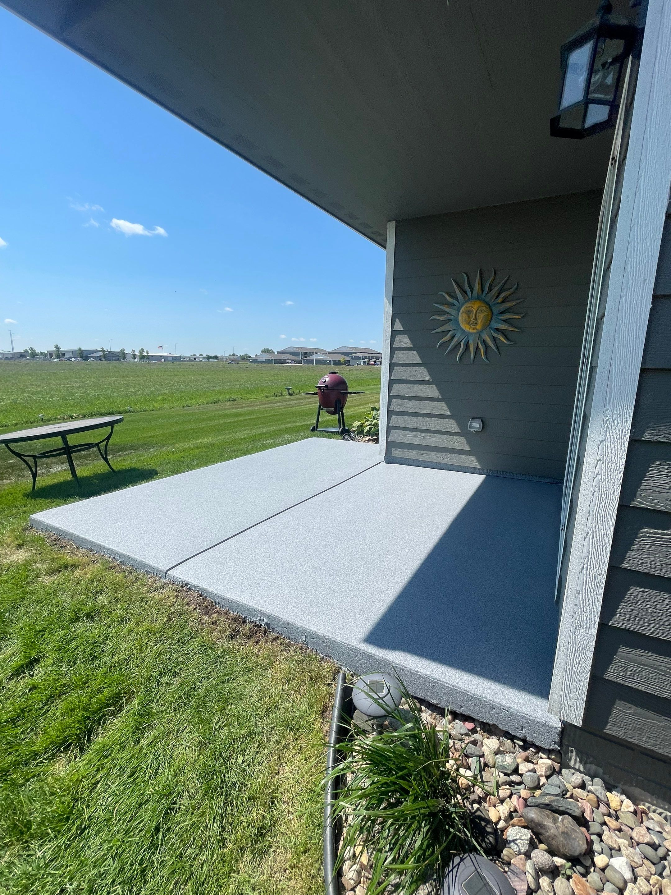 Starry Evening Concrete Patio Coating Installation in Tea by Select Painting, Coatings & Garage Cabinets