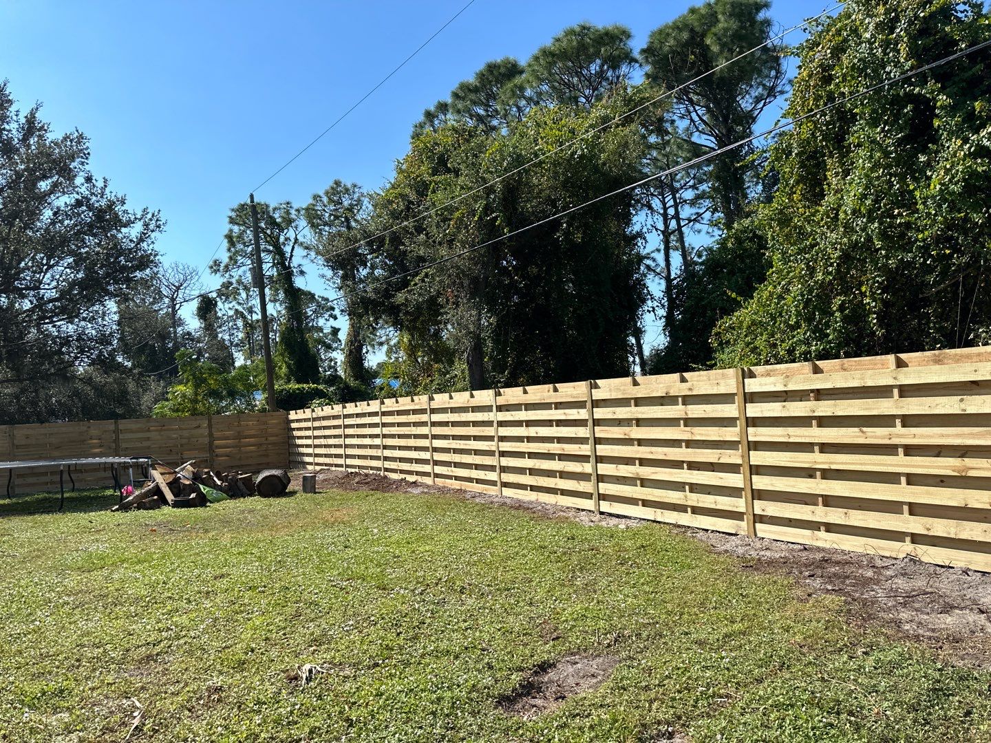 Wood Fence Installation using 6 Ft. Tall Pressure Treated Wood Shadowbox Fence by Asap fence and gates, LLC