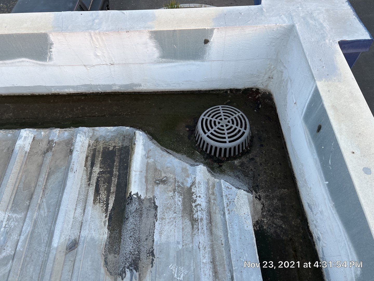 Metal roof restoration on commercial roof using Conklin Benchmark/ PUMA XL acrylic coatings over metal and foam by Straight Edge Roofing Inc