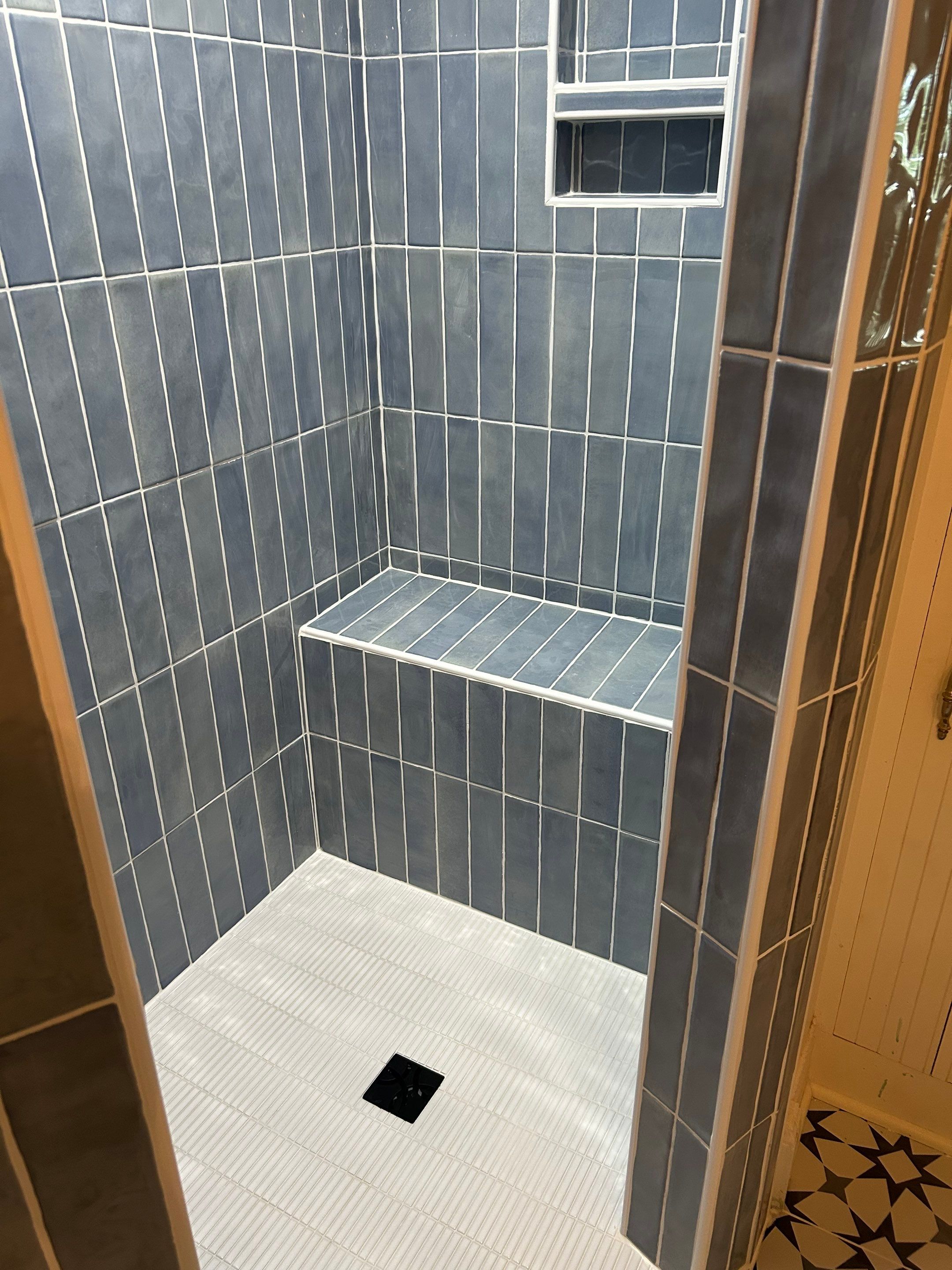 Tile shower and floor by Footprints Floors of Nashville