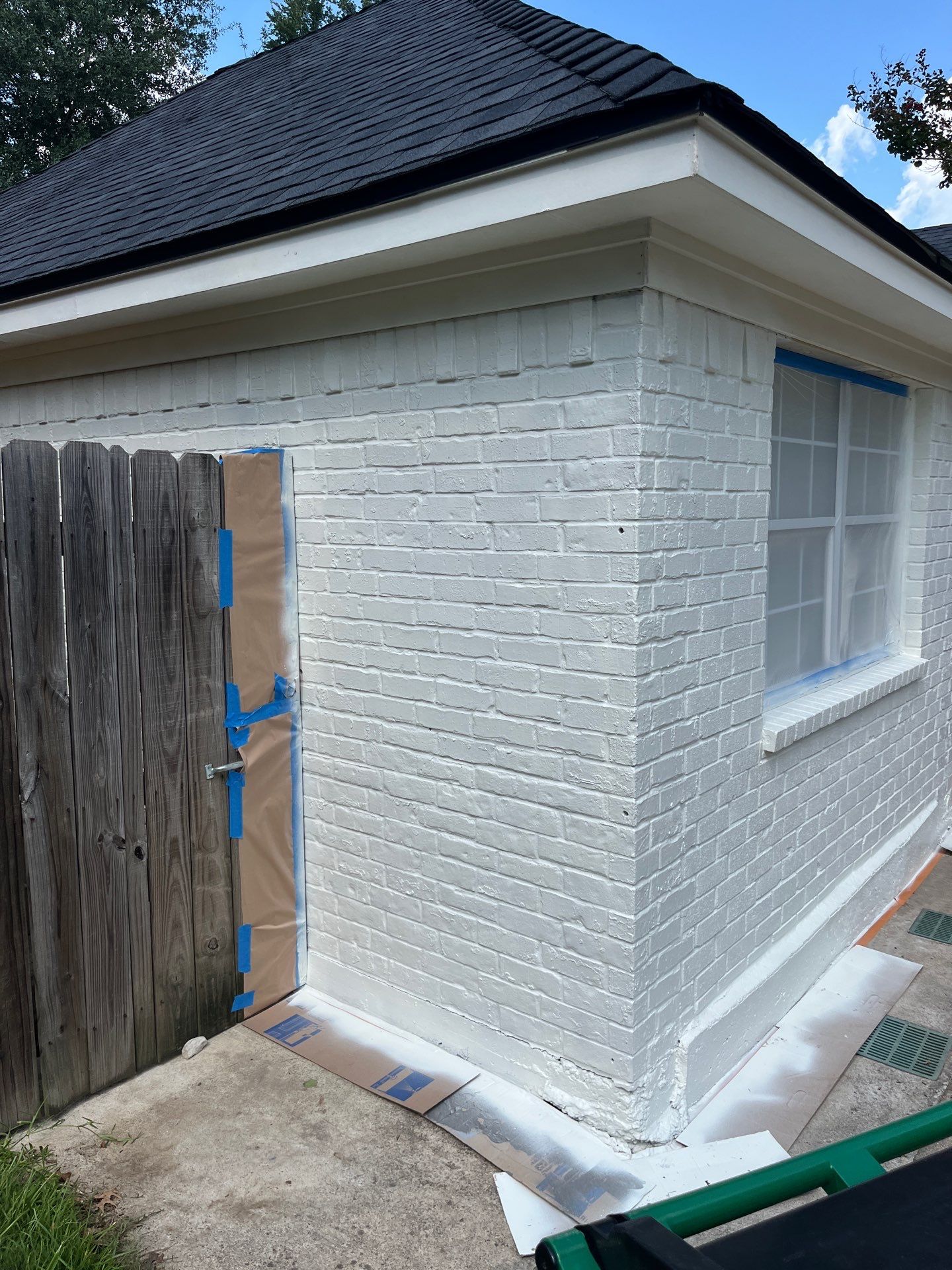 Exterior Painting in Tyler, TX | Brick House with White & Blue Finish by Quality Coats Painting