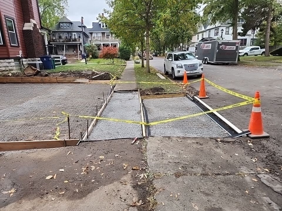 Exterior Renovations- Siding, Stamped Concrete, Porch, and Railings by Ivy Lea Construction