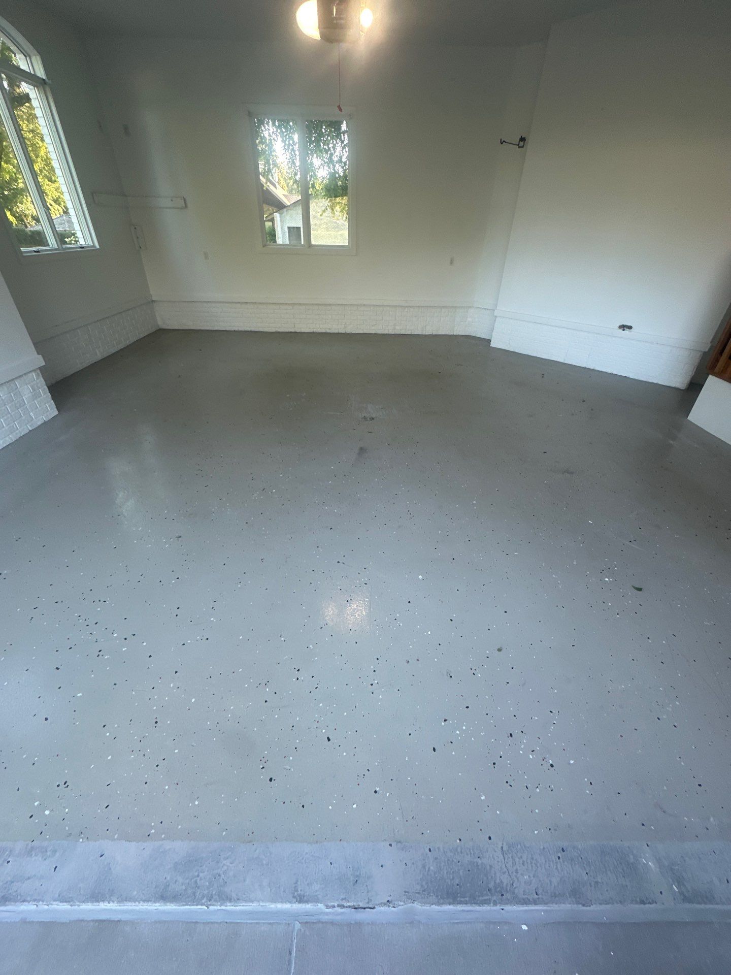 FLEXING 💪 on the Old Epoxy Coating with a Polyaspartic Coating Built to Last 💪  by Revival Concrete Coatings
