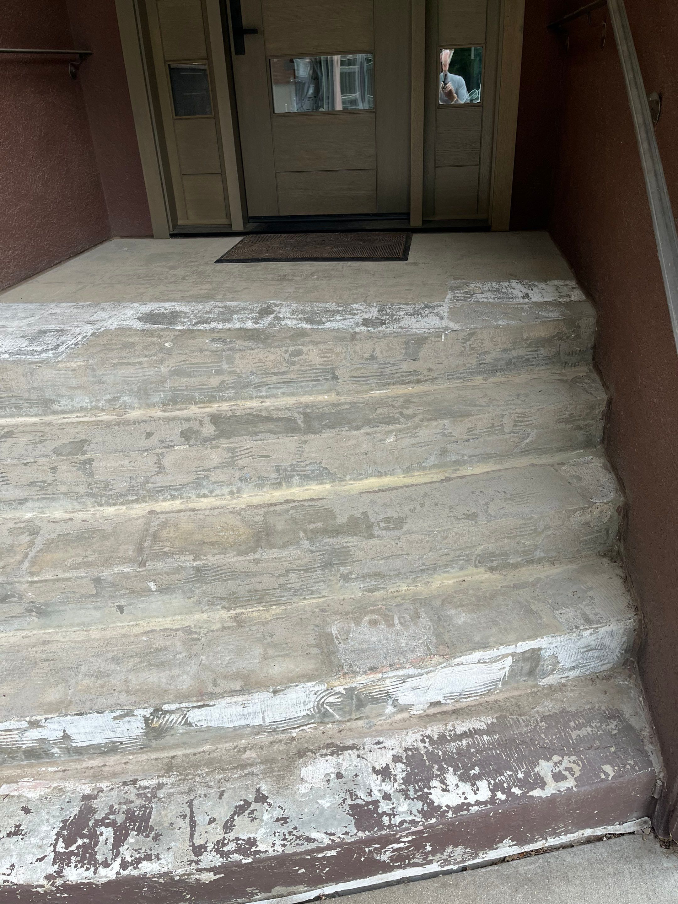 Garage Floor and Entry Step Concrete Coating in Sioux Falls by Select Painting, Coatings & Garage Cabinets