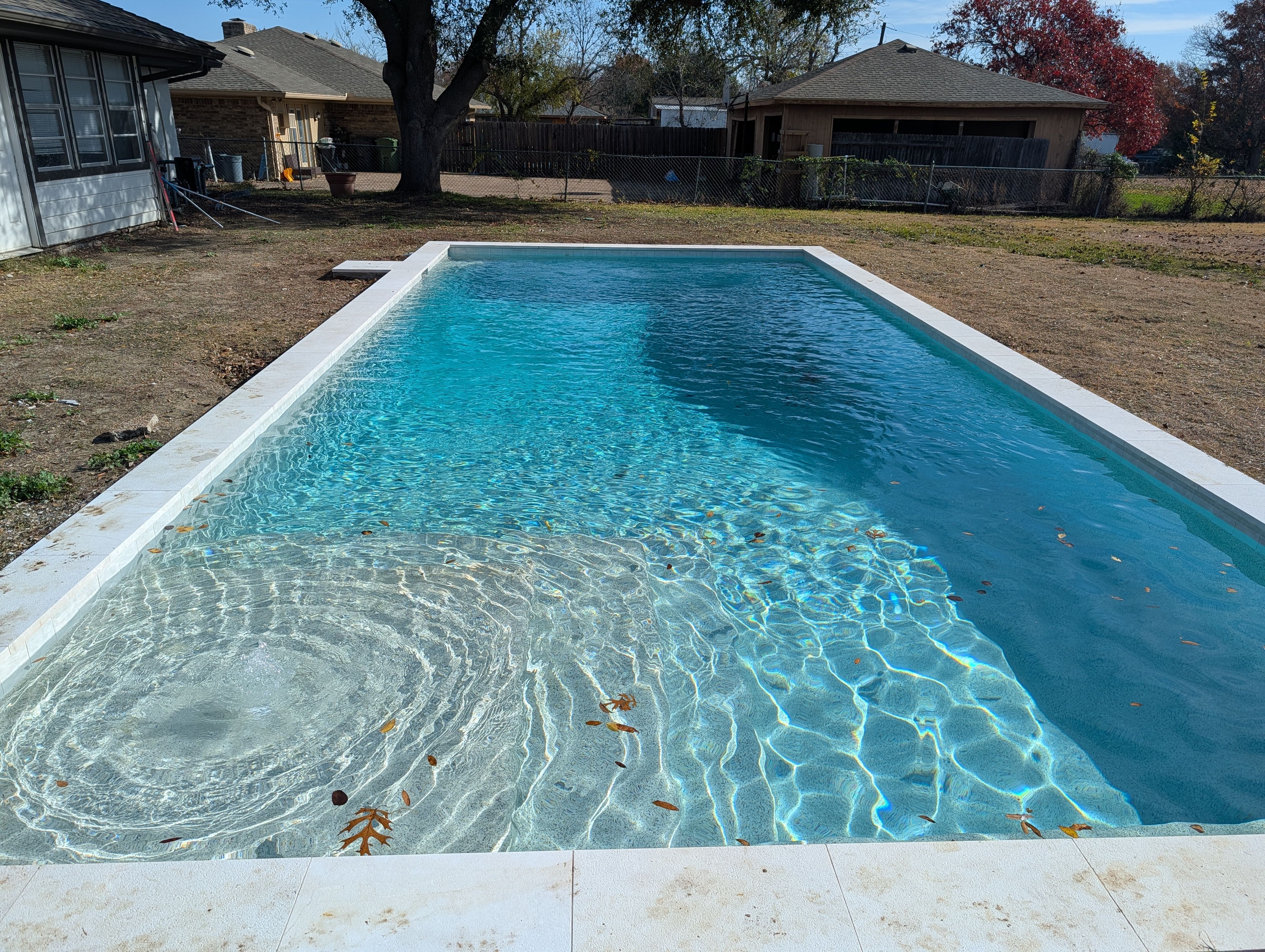 Crisp Geometric Pool with White Coping by Pinnacle Pools and Spas - DFW