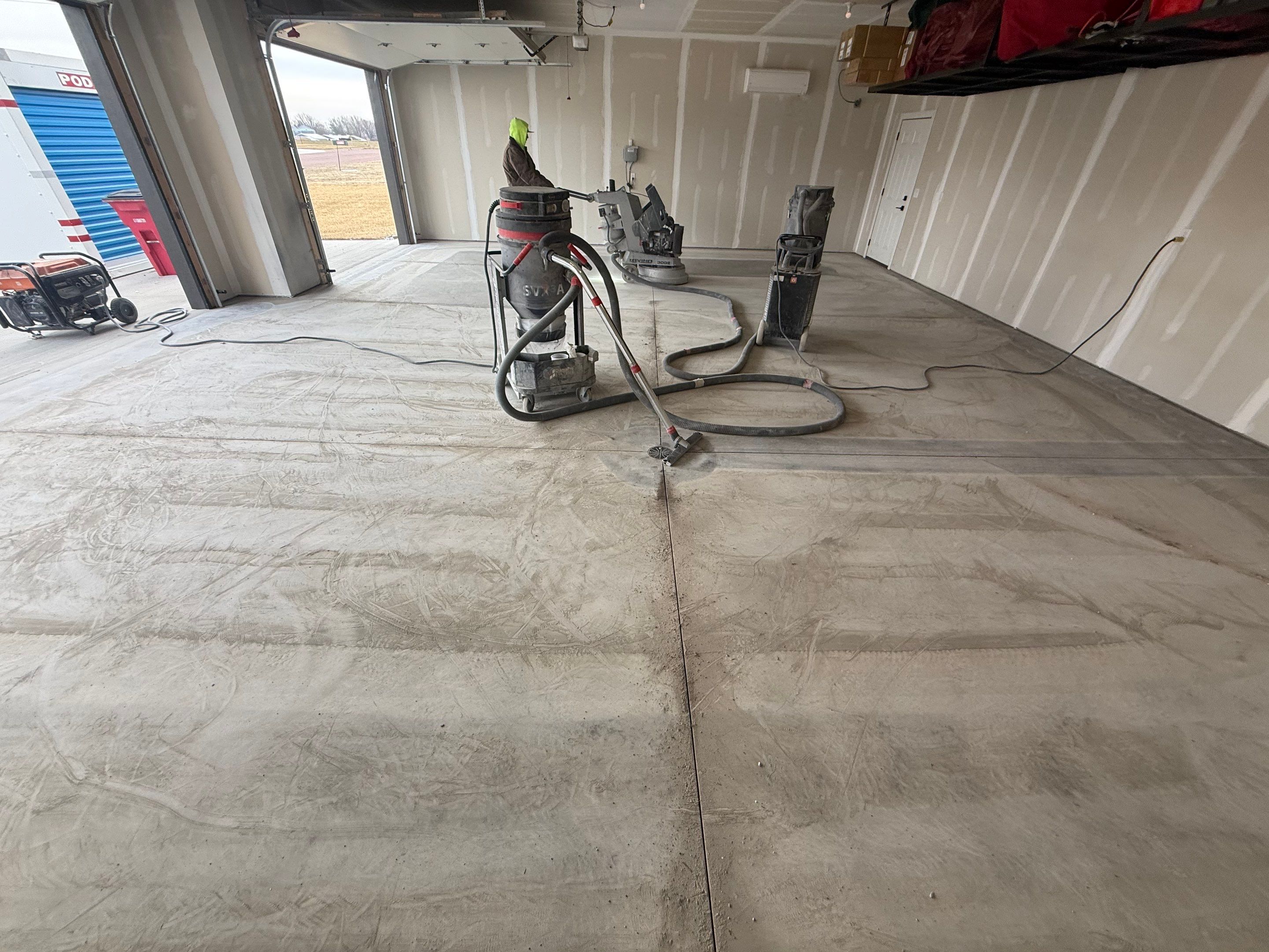Grey Speckled Epoxy Floor Coating for Sioux Falls Garage by Select Painting, Coatings & Garage Cabinets