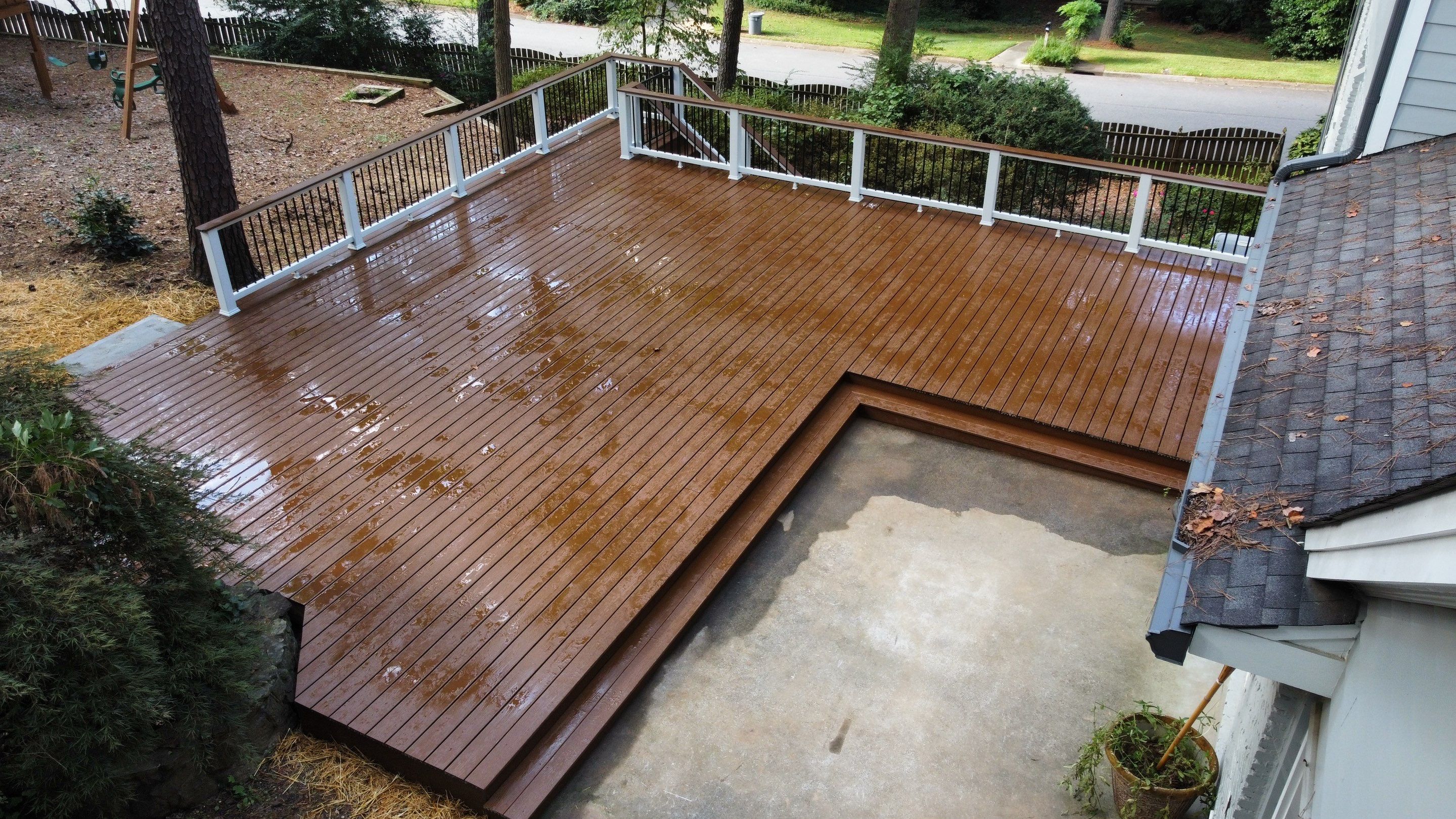 Custom Stained Wood Deck Installation with White Railings in Atlanta by Swift Home Renovations