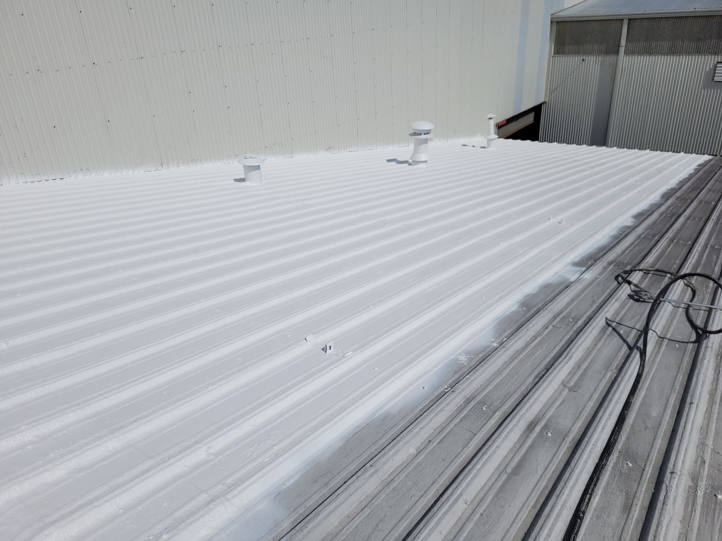 Commercial Metal Restoration System using Aldocoat Coatings by Hostetler Roofing