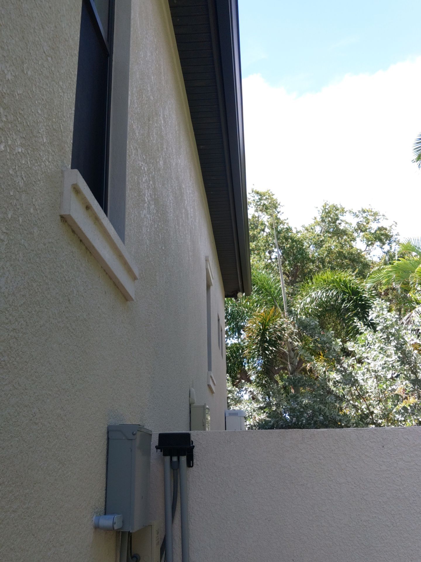 Bronze Gutters and Almond Downspouts in Longboat Key FL by Gutter Professors