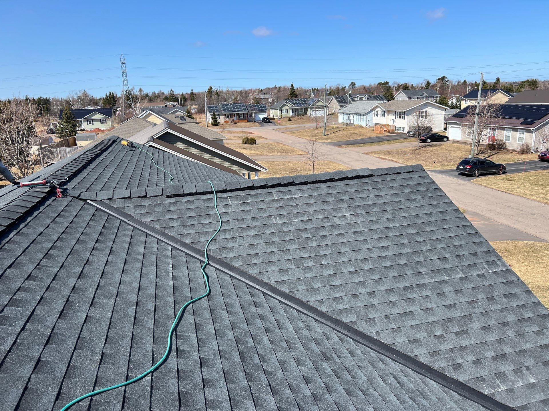 Residential Roofing Installation using Asphalt GAF HDZ in Charcoal by Artisan Roofing & Home Improvements Inc.