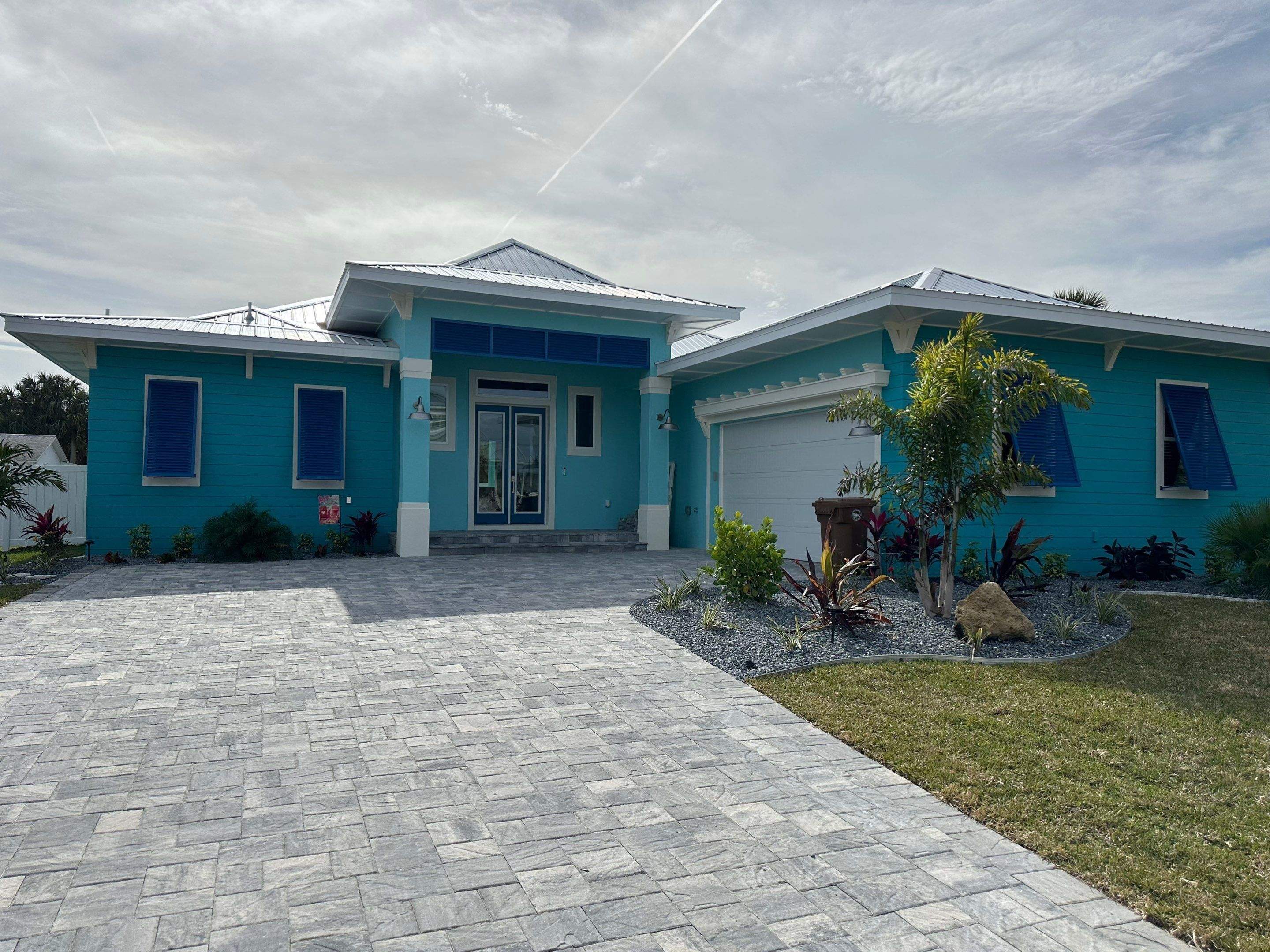 Bahama Shutters in Capri Blue by Smart Guard Shutters