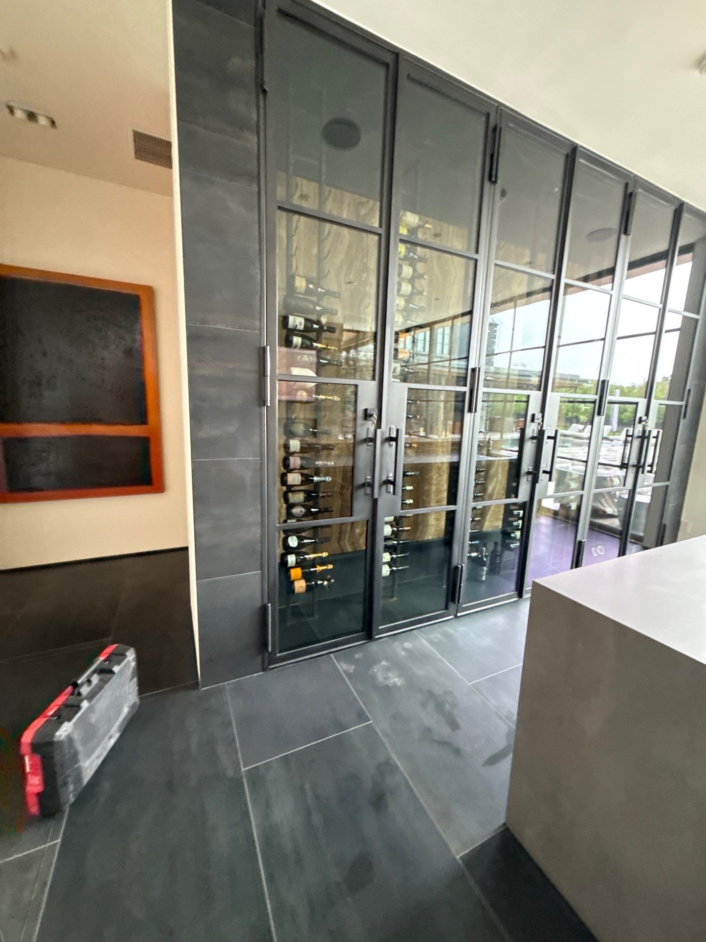 Custom Black-Framed Glass Wine Cellar Installation in Dallas by Solara Custom Living