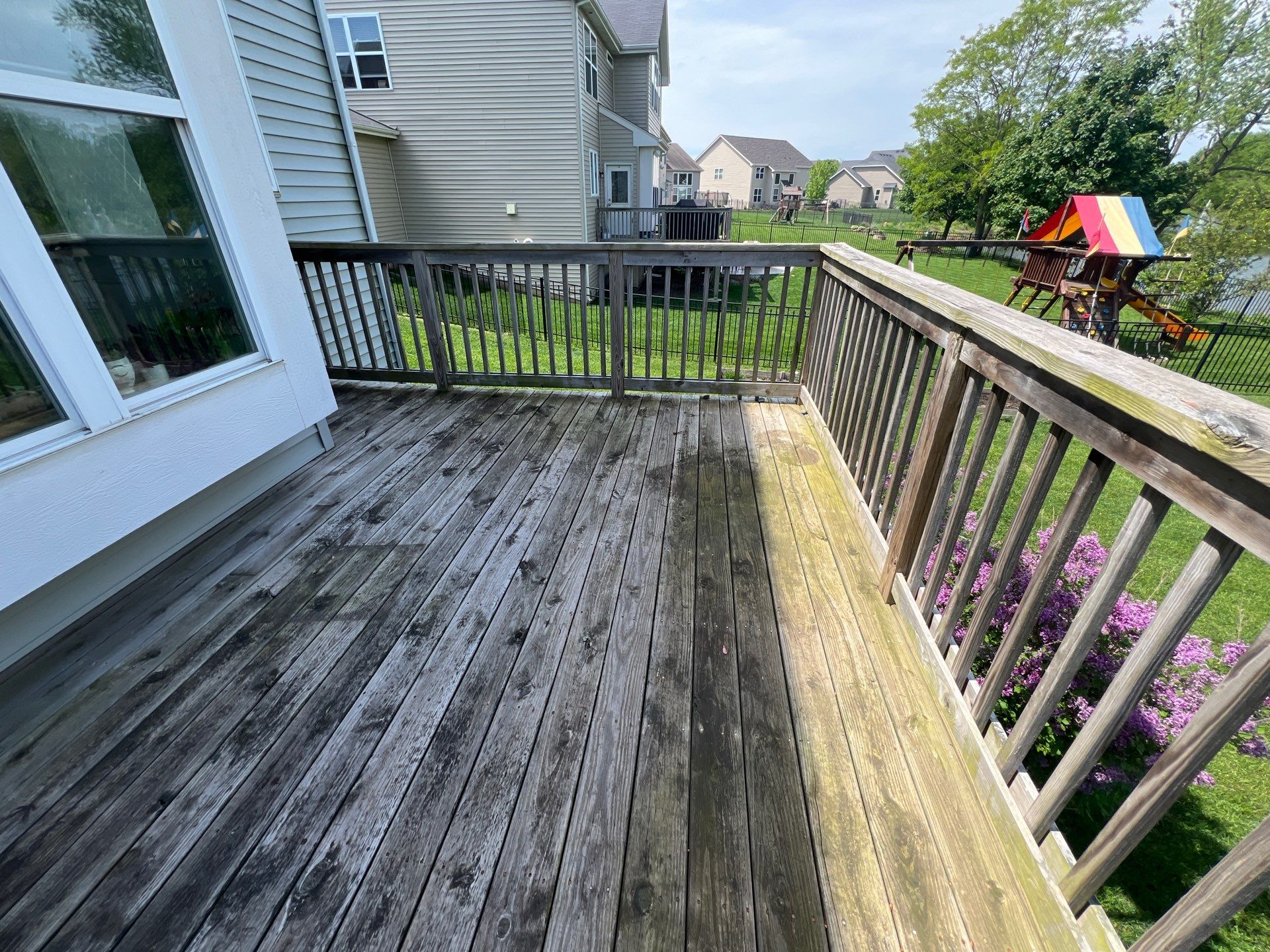 wood deck cleaning and staining by Northern Power Washing LLC.