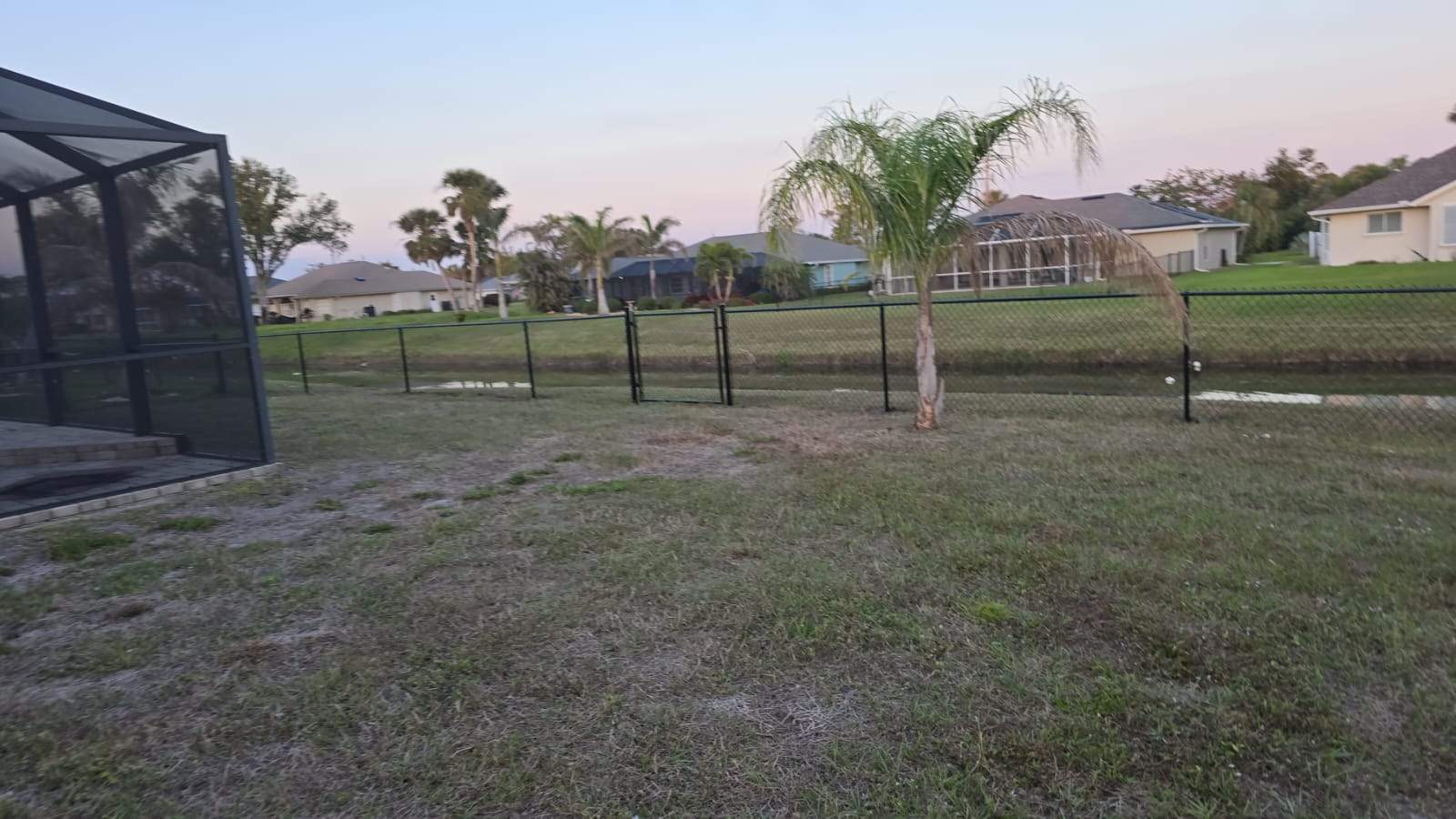 Waterfront Black Chain Link Fence Installation in Rotonda West by True Fence LLC