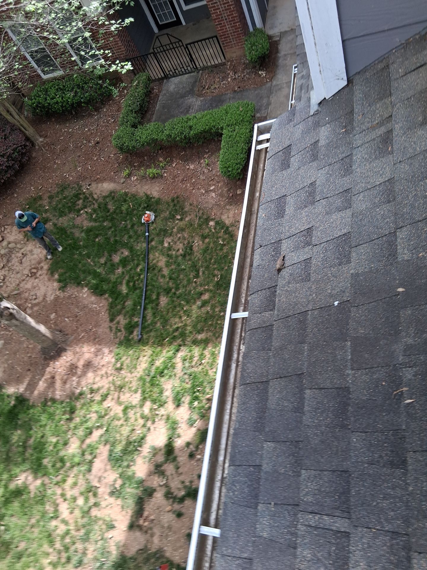 HOA gutter cleaning in Huntersville, NC, after  photo showing full gutters.