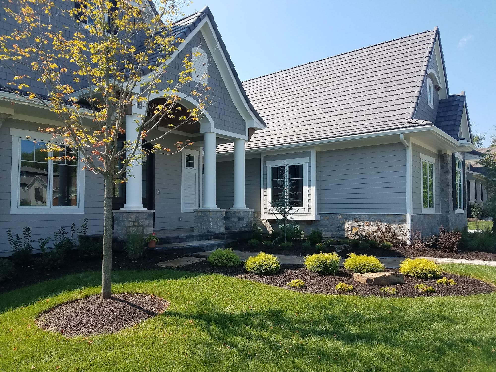 Front Yard Landscape and Walkway Renovation in Overland Park by LAND ESCAPES LLC