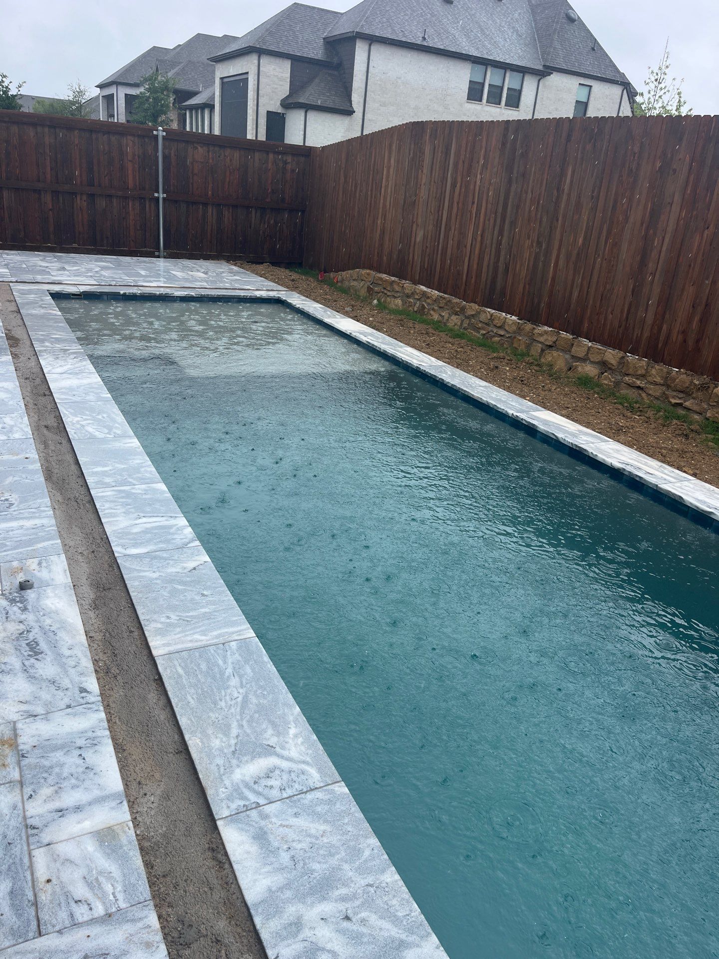 Geometric Pool with Raised Spa and Sheer Descent Waterfall by Pinnacle Pools and Spas - DFW